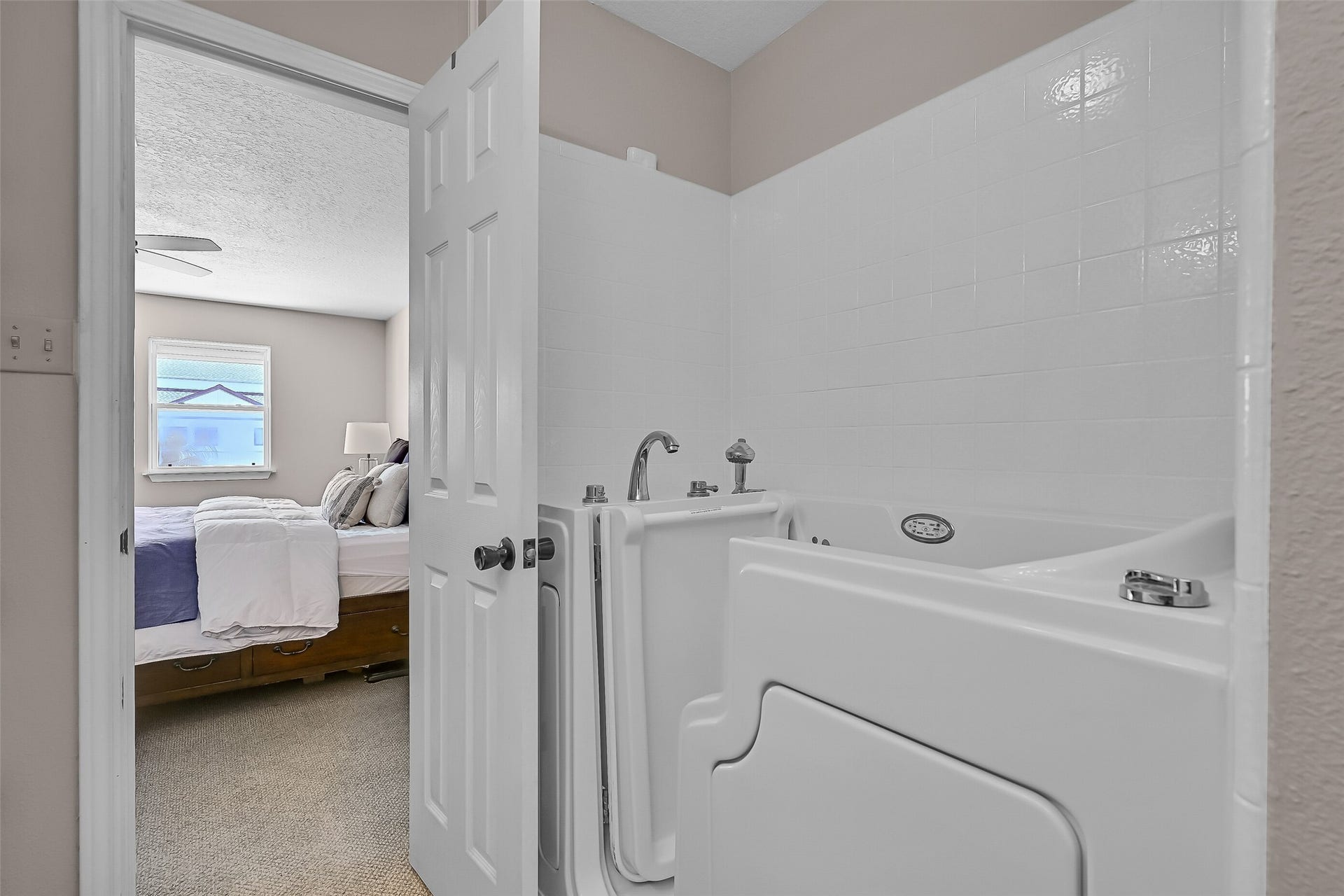 243 Isles End Road, #RR2, Tiki Island, TX 77554 Designed with accessibility in mind, the primary bath includes a walk-in soaking tub and additional storage. Its location directly off the primary suite offers convenience while keeping all essential living spaces together on the main level.