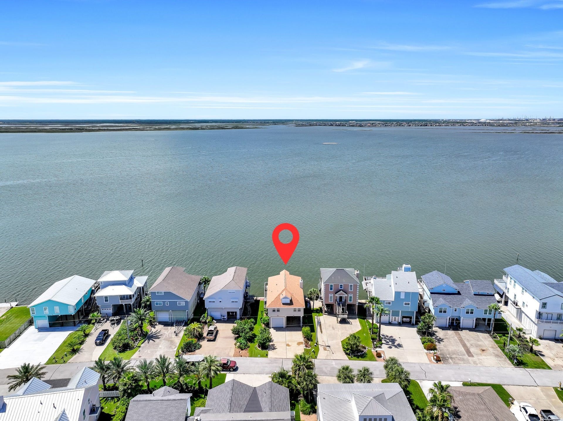 243 Isles End Road, #RR2, Tiki Island, TX 77554 Perfectly positioned along the shoreline of Jones Bay, this waterfront home enjoys an exceptional location with sweeping open-water views and immediate access to West Bay beyond. From sunrise reflections on the water to spectacular west-facing sunsets, the setting is truly one of Tiki Island's greatest luxuries.