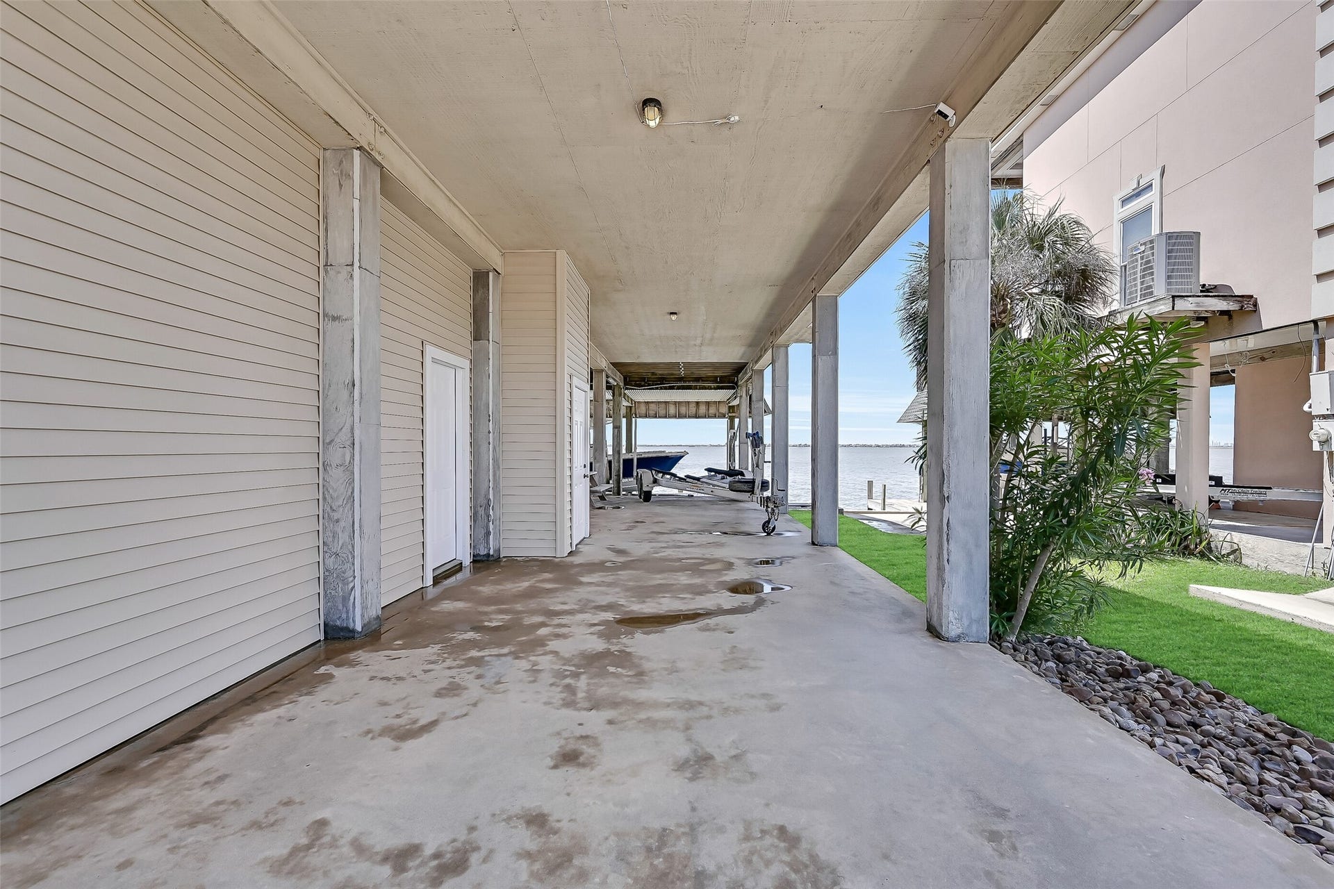 243 Isles End Road, #RR2, Tiki Island, TX 77554 The ground level offers extensive covered space beneath the home, providing room for parking, storage, outdoor gear, and easy access to the waterfront. Whether you're unloading fishing equipment, rinsing off after a day on the bay, or preparing for a sunset cruise, this versatile space is designed for the coastal lifestyle.