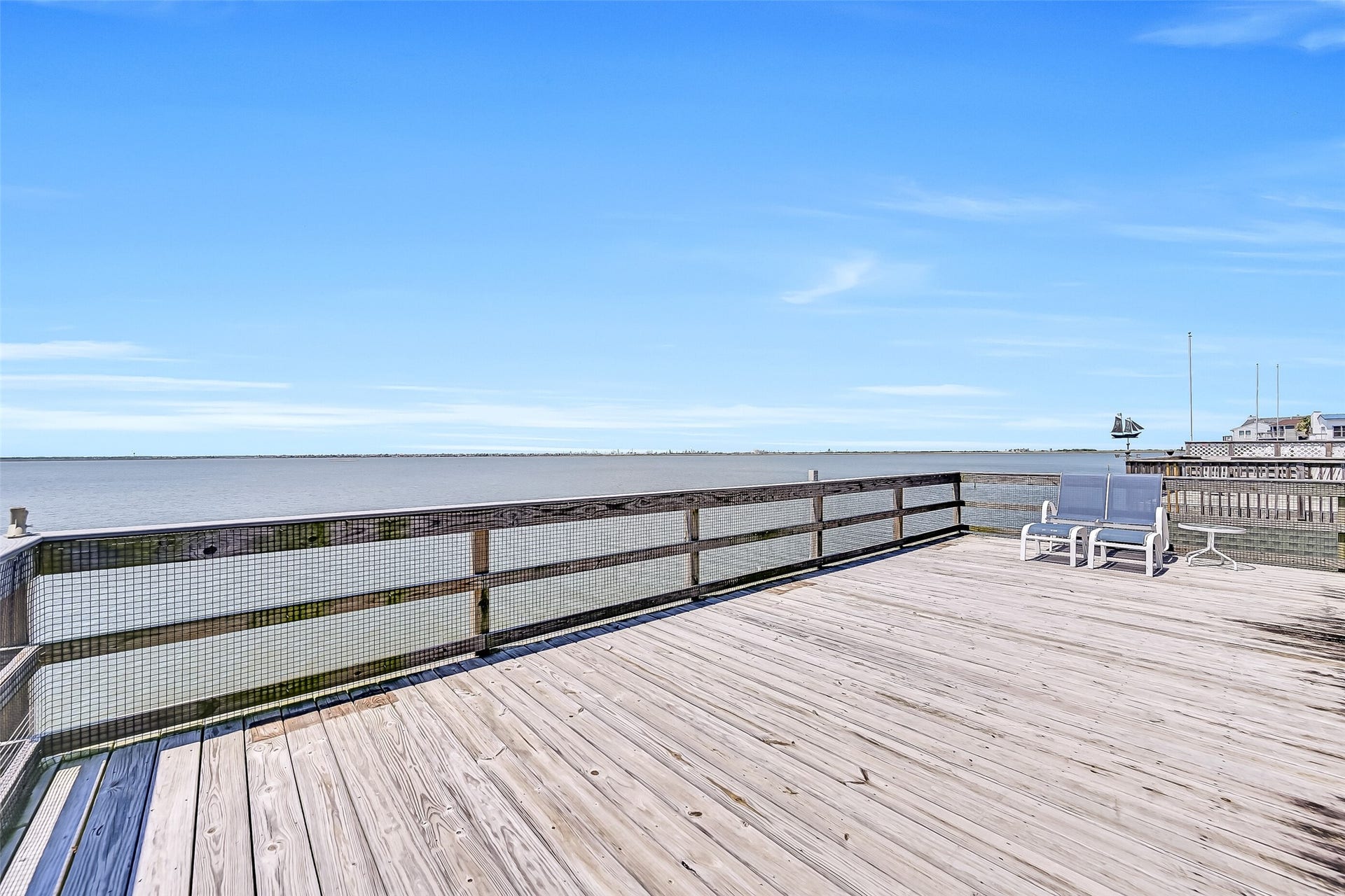 243 Isles End Road, #RR2, Tiki Island, TX 77554 The view is the star of the show. From this elevated vantage point, enjoy sweeping vistas across Jones Bay as it opens into West Bay, with ever-changing skies, passing boats, abundant coastal wildlife, and breathtaking sunsets painted across the western horizon. This is the kind of waterfront setting buyers dream about when they picture life on Tiki Island.