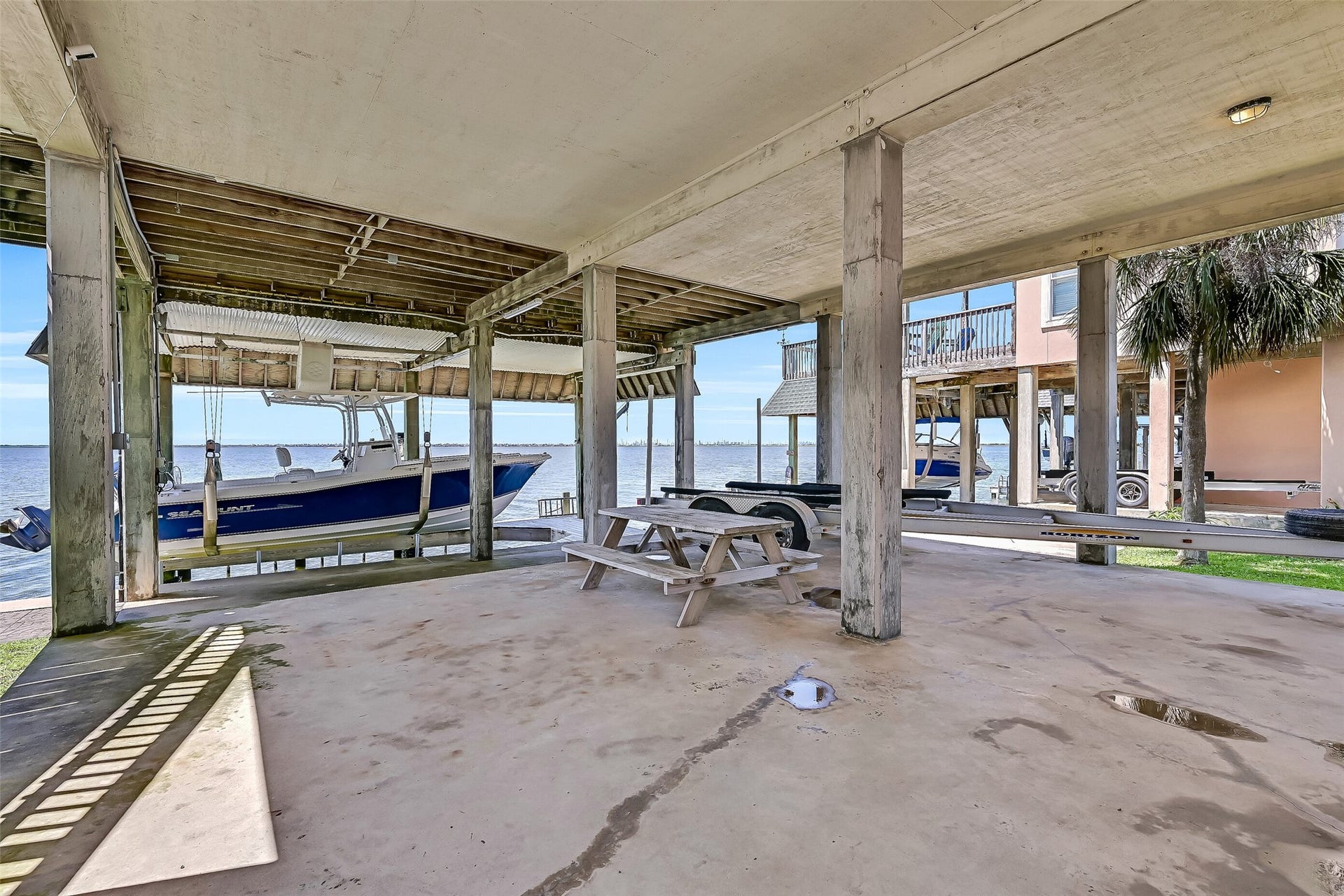 243 Isles End Road, #RR2, Tiki Island, TX 77554 Beneath the home, you'll find additional covered waterfront space perfect for relaxing in the shade, gathering with friends, or preparing for a day on the water. With Jones Bay just steps away and panoramic water views in every direction, even the lower level captures the laid-back charm of island living.