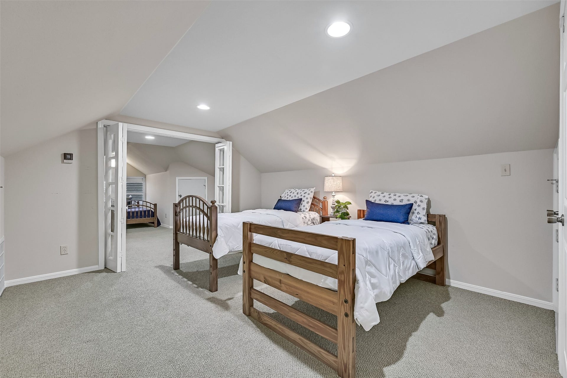 243 Isles End Road, #RR2, Tiki Island, TX 77554 French doors connect two large flex rooms, creating a flexible layout ideal for guests, multi-generational living, hobbies, or a combination of sleeping and recreation space. The generous square footage allows this level to function however your lifestyle demands.