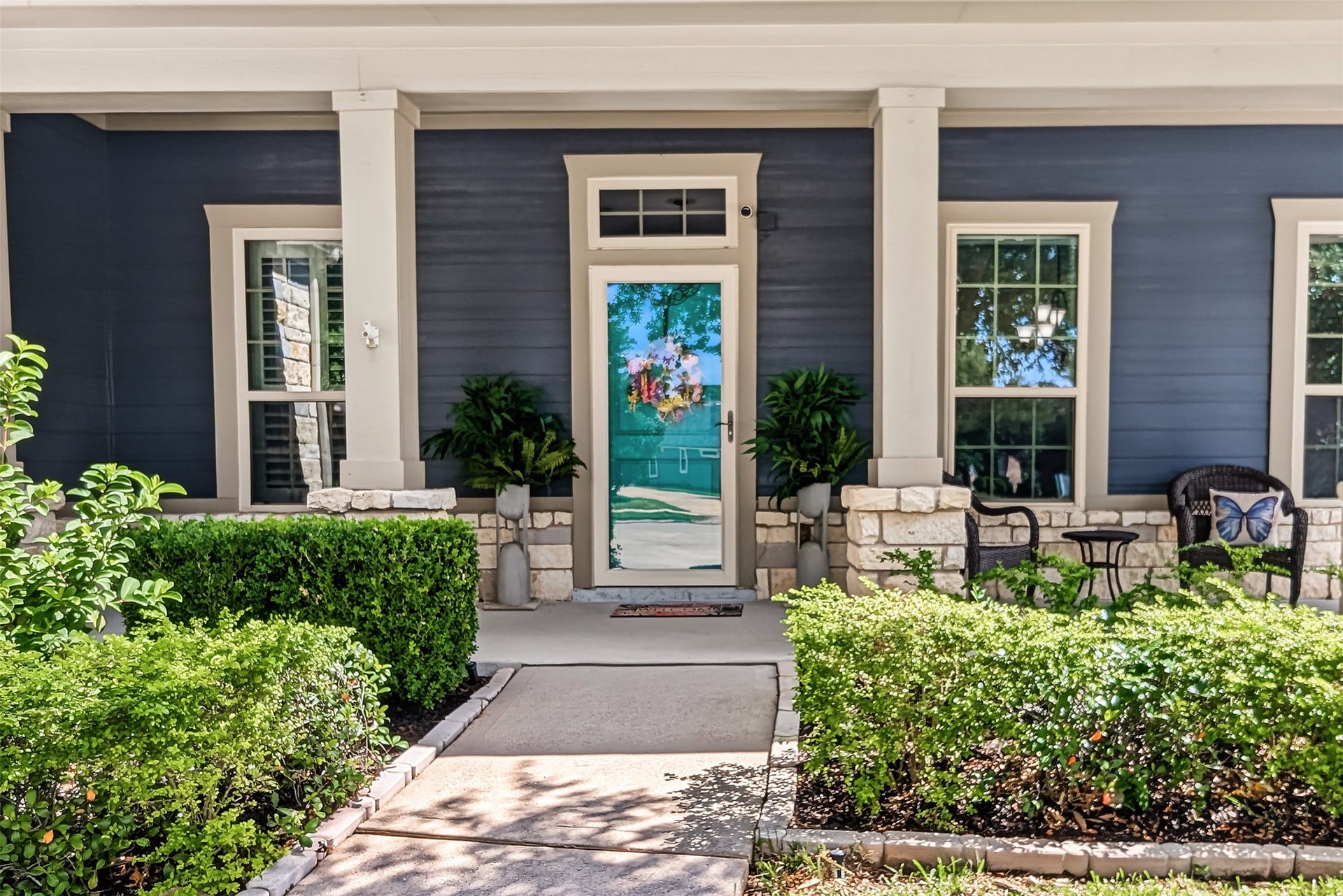 Charming front porch with a stylish deck, perfect for relaxing.