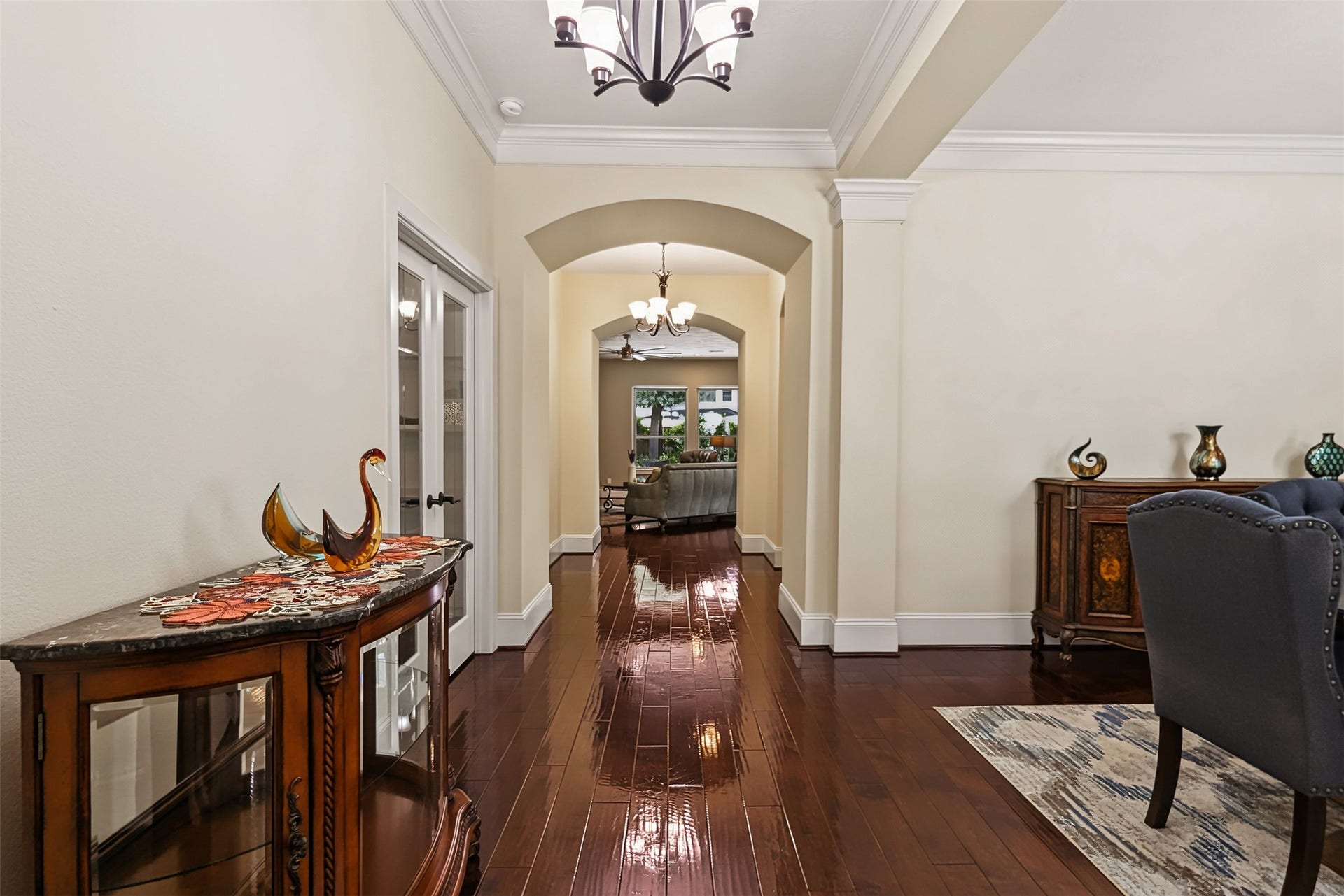 Experience the elegance of soaring ceilings and impressive 8-foot doors throughout.