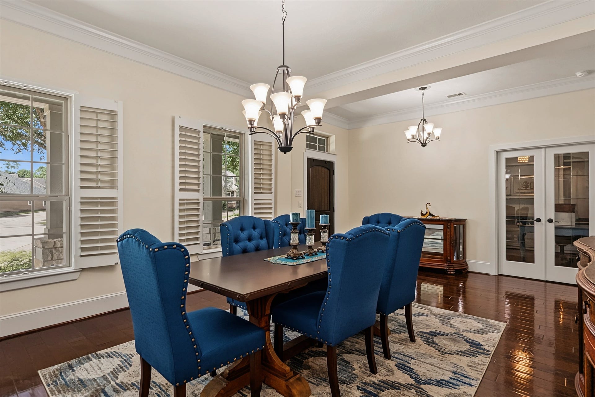 Another view of the dining room, plantation shutters and engineered wood floors