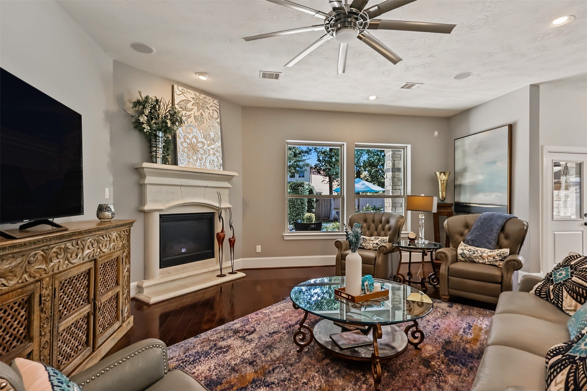 Family room is open to the kitchen and breakfast area with backyard Oasis views.