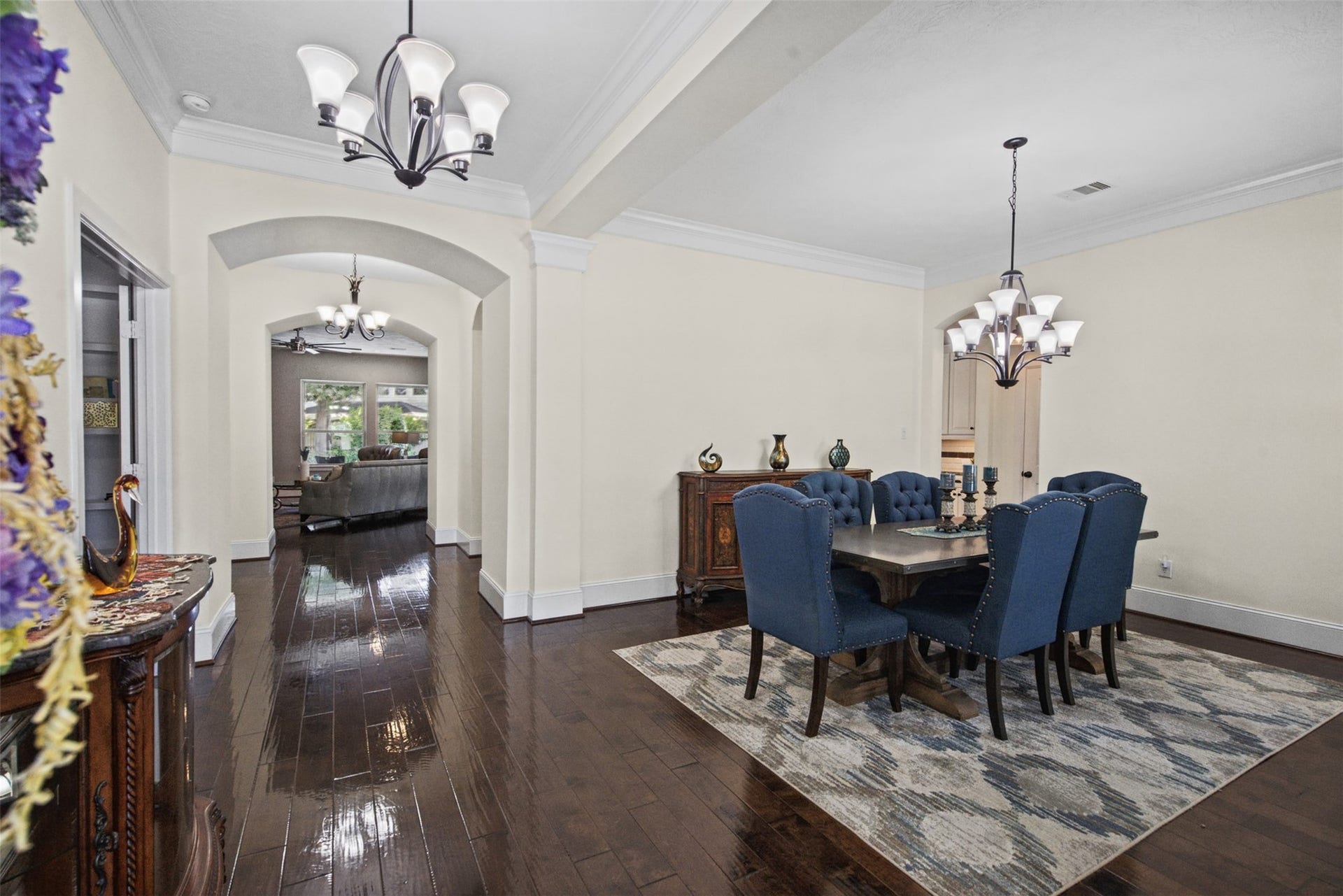 Elegant engineered flooring enhances the main living areas.