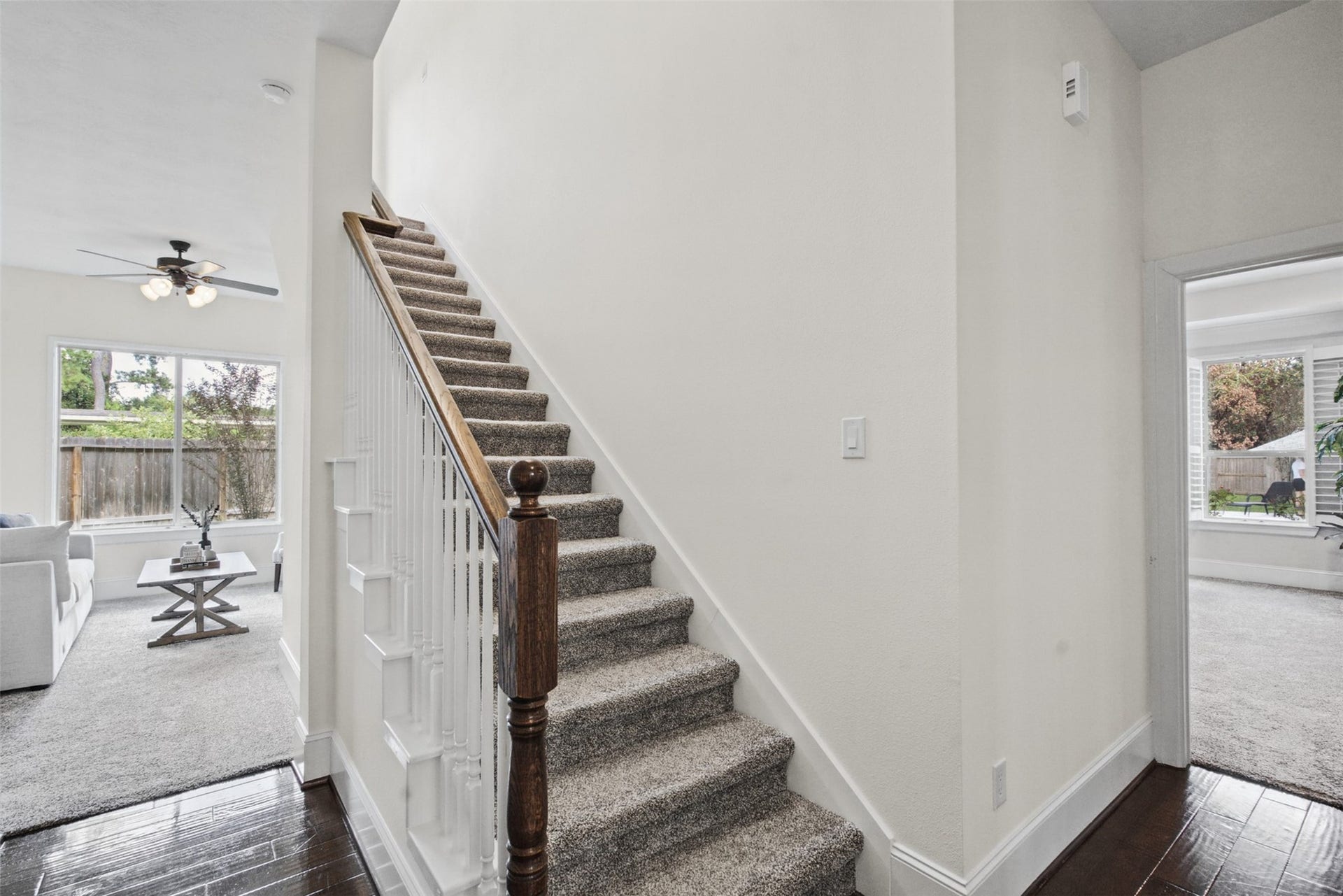 Ascend to a spacious game room featuring elegant vinyl flooring and a full bathroom.