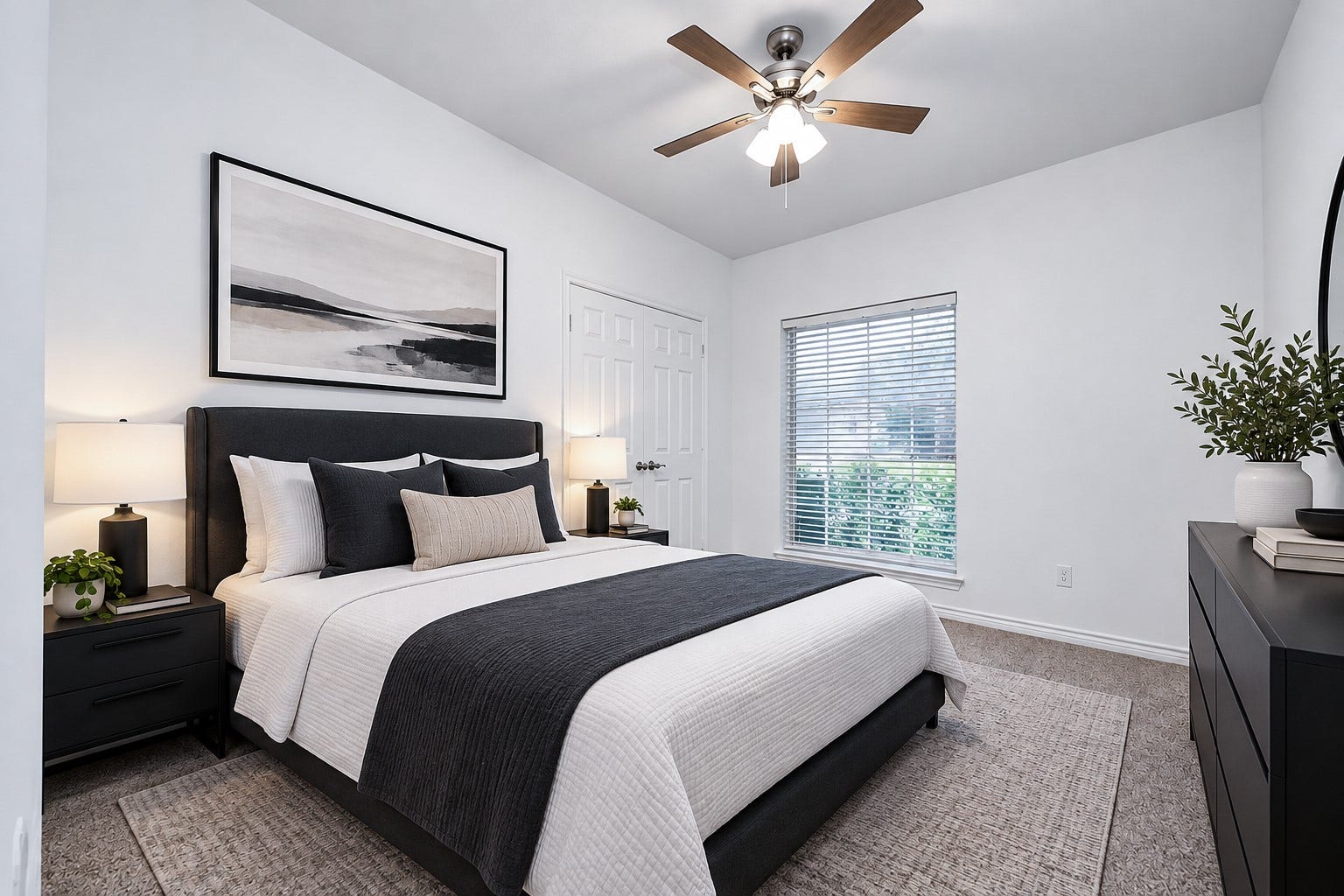 Virtually staged first bedroom with plenty of natural light from a large window.