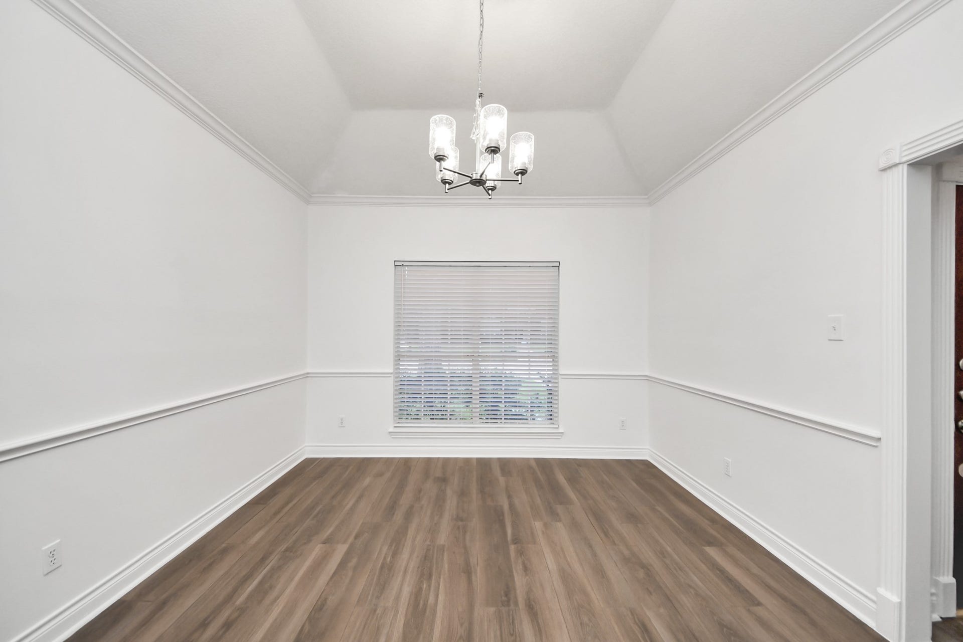 Dining room featuring a stylish chandelier, perfect for hosting gatherings.