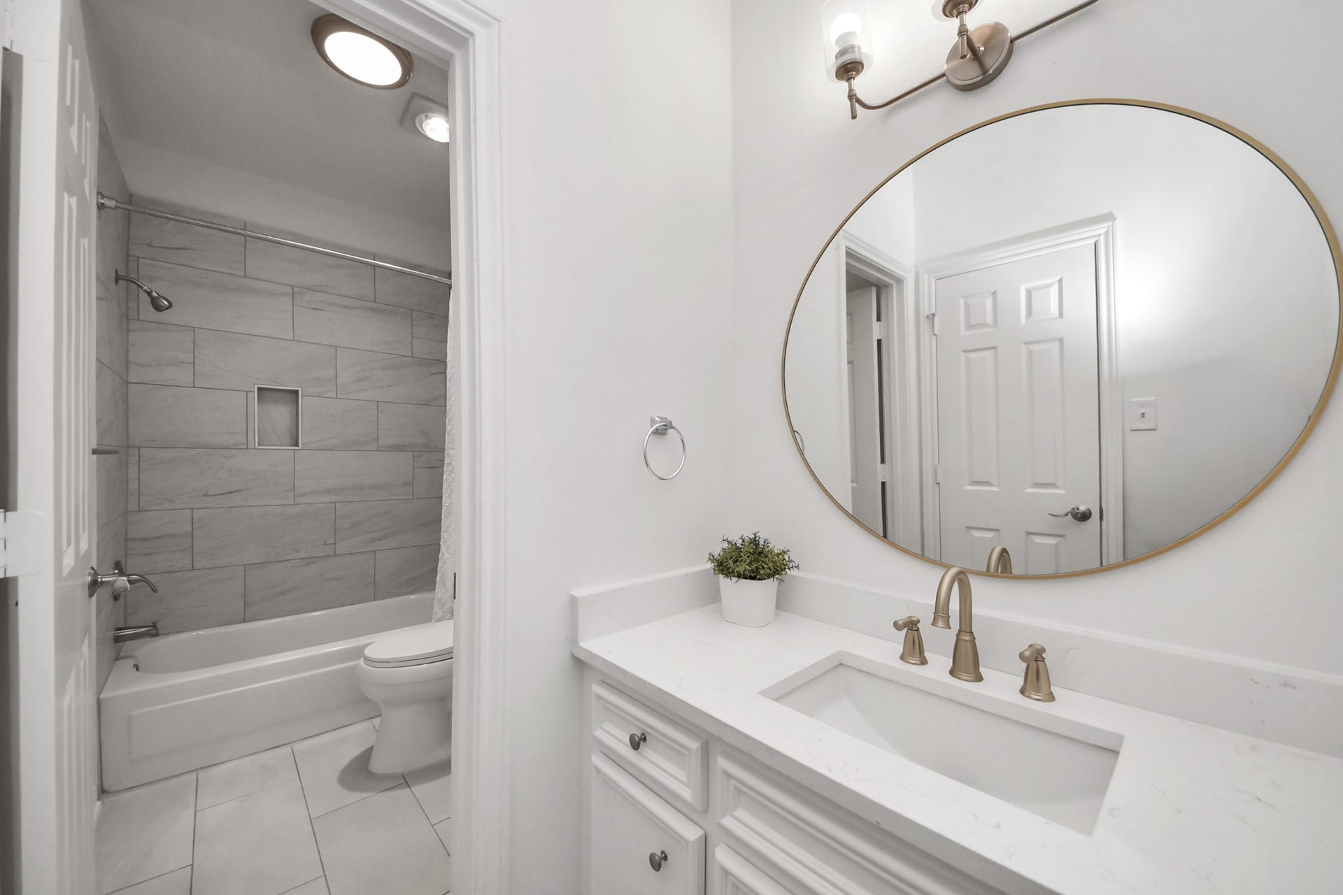 Tiled bathtub and shower.