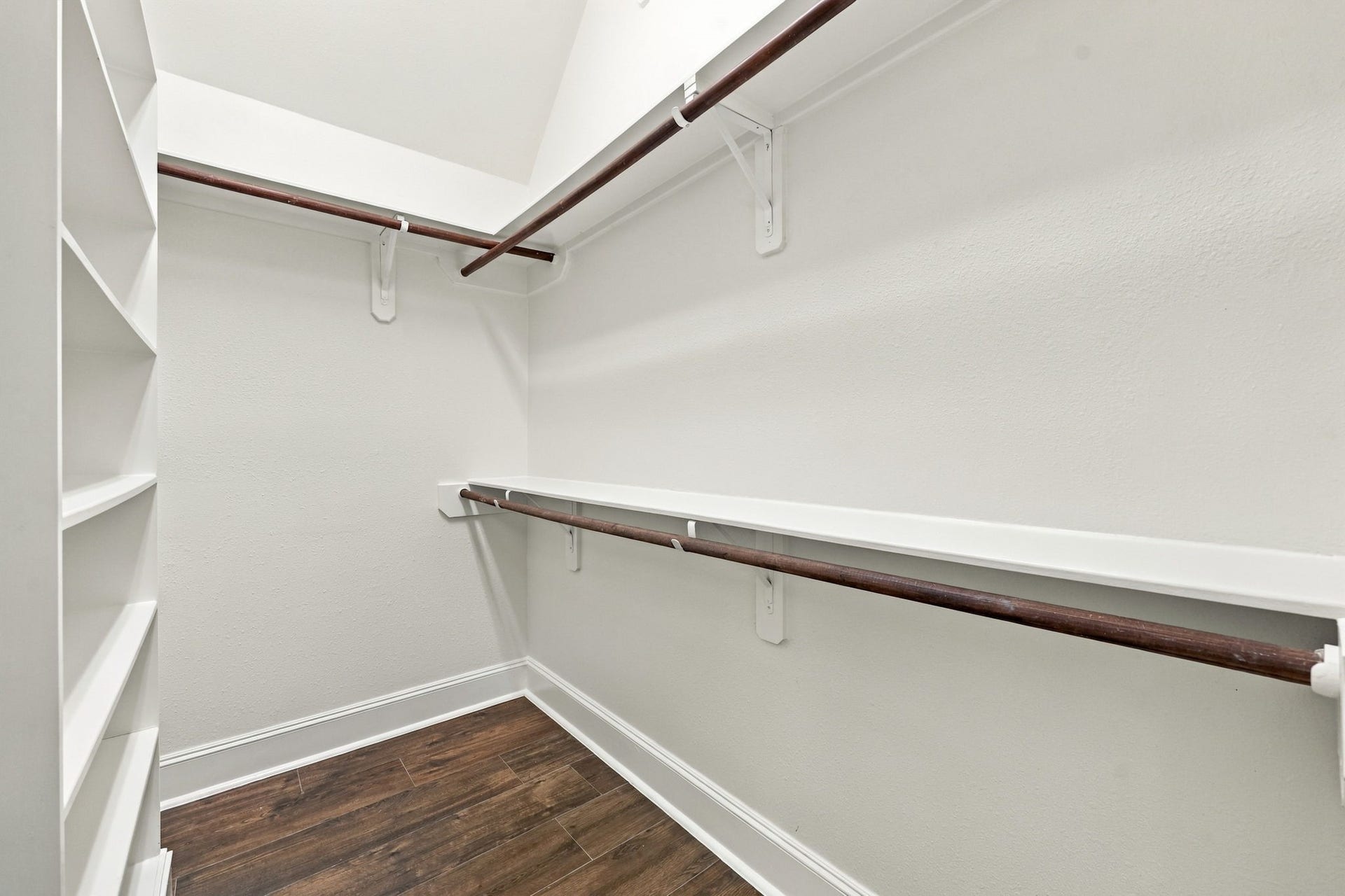 33211 Woodton Court, Weston Lakes, TX 77441 The Primary Suite features two spacious walk-in closets, each thoughtfully designed with built-in storage to keep your wardrobe, shoes, and accessories organized and easily accessible.