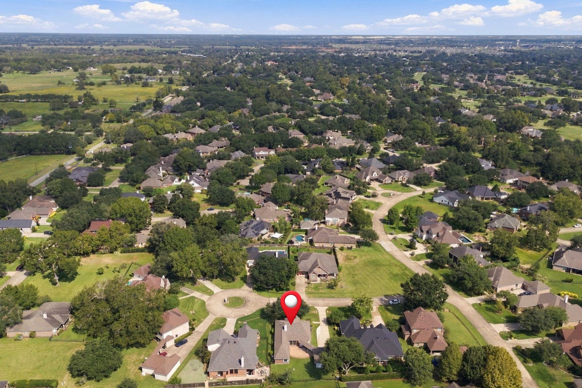 33211 Woodton Court, Weston Lakes, TX 77441 This aerial view looks north, providing a broader perspective of the surrounding area. The home has been pinpointed for easy reference.