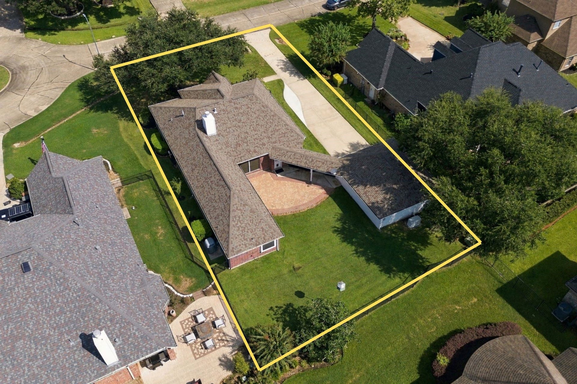 33211 Woodton Court, Weston Lakes, TX 77441 An aerial view showcases how this beautiful home is situated on its oversized 11,021-square-foot lot, highlighting the spacious property, mature landscaping, extended patio, oversized detached garage, and desirable cul-de-sac location. The north/south orientation is an added bonus, helping provide more comfortable outdoor living during our hot Texas summers. Property lines are approximate and are not guaranteed.