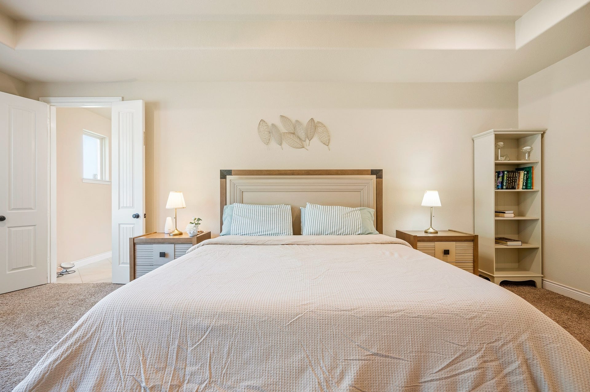 25610 Buckley Bluff Lane, Katy, TX 77494 Experience the tranquility of a spacious bedroom, featuring a cozy bed, soft lighting, and a calming neutral palette for the perfect serene retreat.