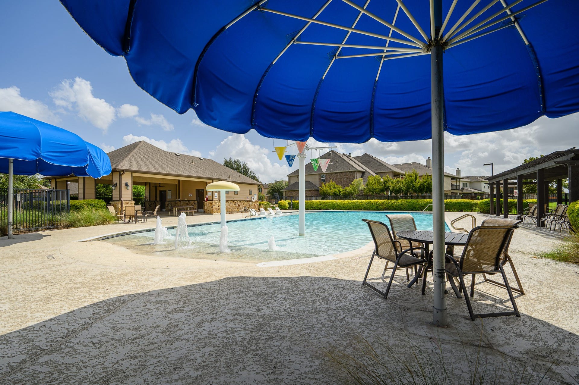 25610 Buckley Bluff Lane, Katy, TX 77494 Indulge in resort-style living with a sparkling pool, shaded seating, and a stylish clubhouse perfect for relaxation and entertaining.