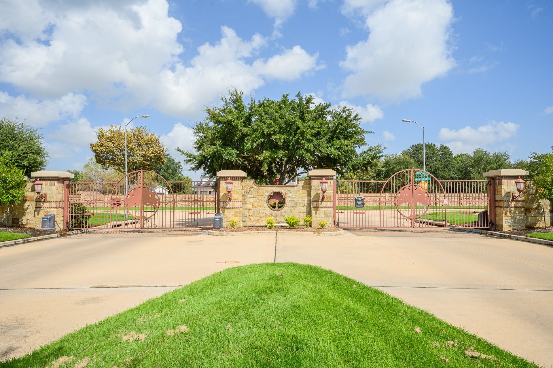 25610 Buckley Bluff Lane, Katy, TX 77494 An elegant gated entrance with stately stone pillars and meticulous landscaping offers unmatched security and privacy.