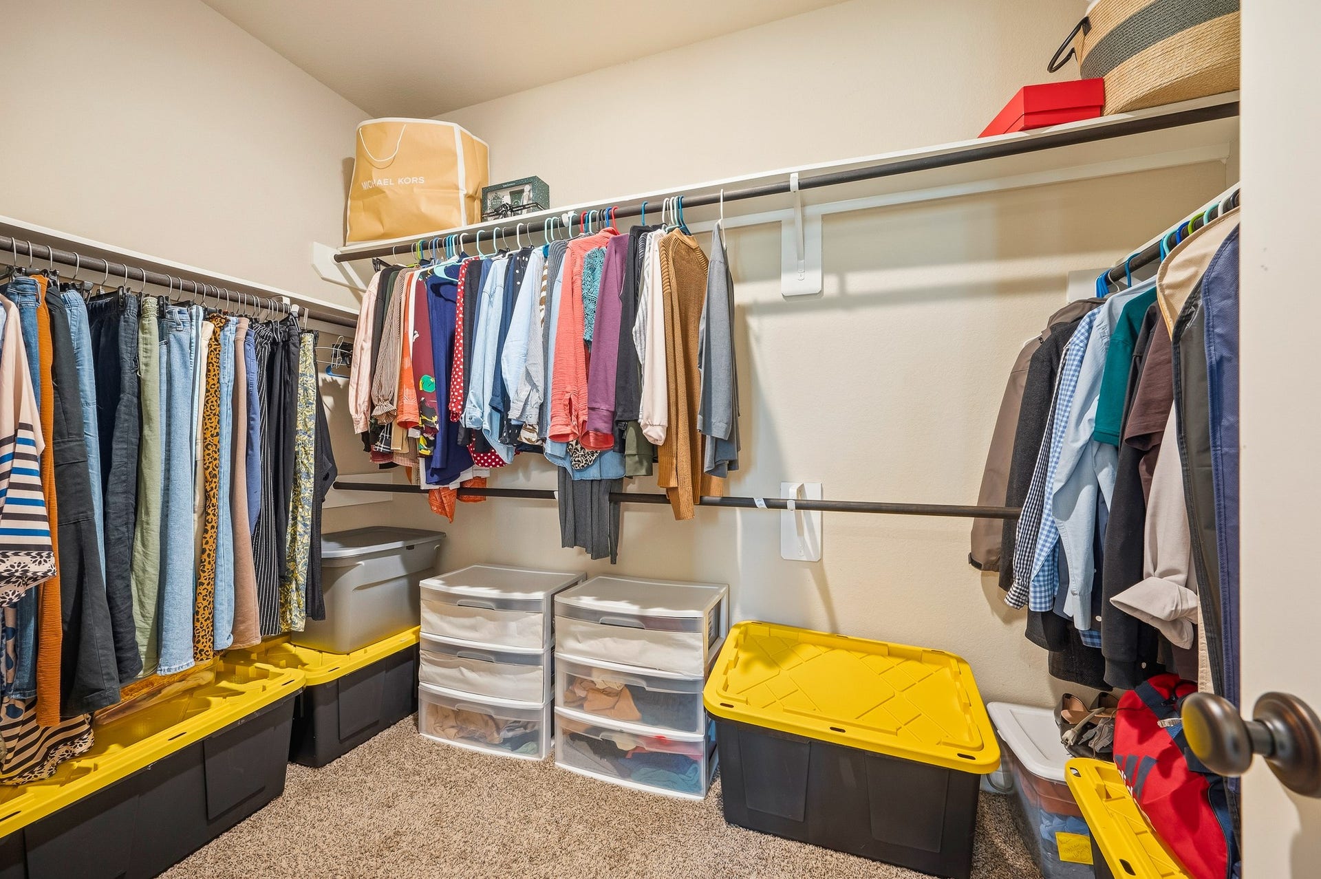 25610 Buckley Bluff Lane, Katy, TX 77494 Discover a spacious walk-in closet offering ample hanging space and organized storage, keeping your wardrobe tidy and accessible.