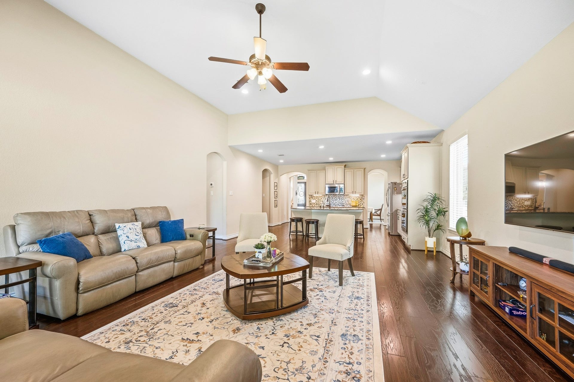 25610 Buckley Bluff Lane, Katy, TX 77494 Discover the perfect blend of elegance and functionality in this spacious living area, featuring high ceilings, hardwood floors, and an open layout seamlessly connecting to a modern kitchenideal for entertaining and relaxation.