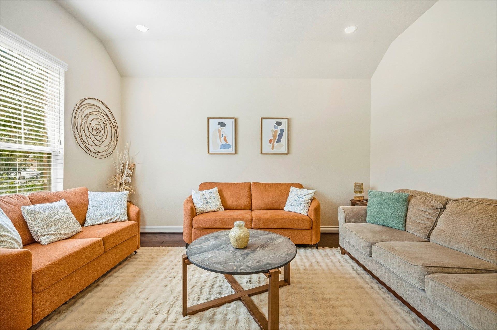 25610 Buckley Bluff Lane, Katy, TX 77494 Bright and inviting, this living room boasts cozy sofas, stylish decor, and large windows that flood the space with natural light, creating the perfect setting for relaxation and entertaining.