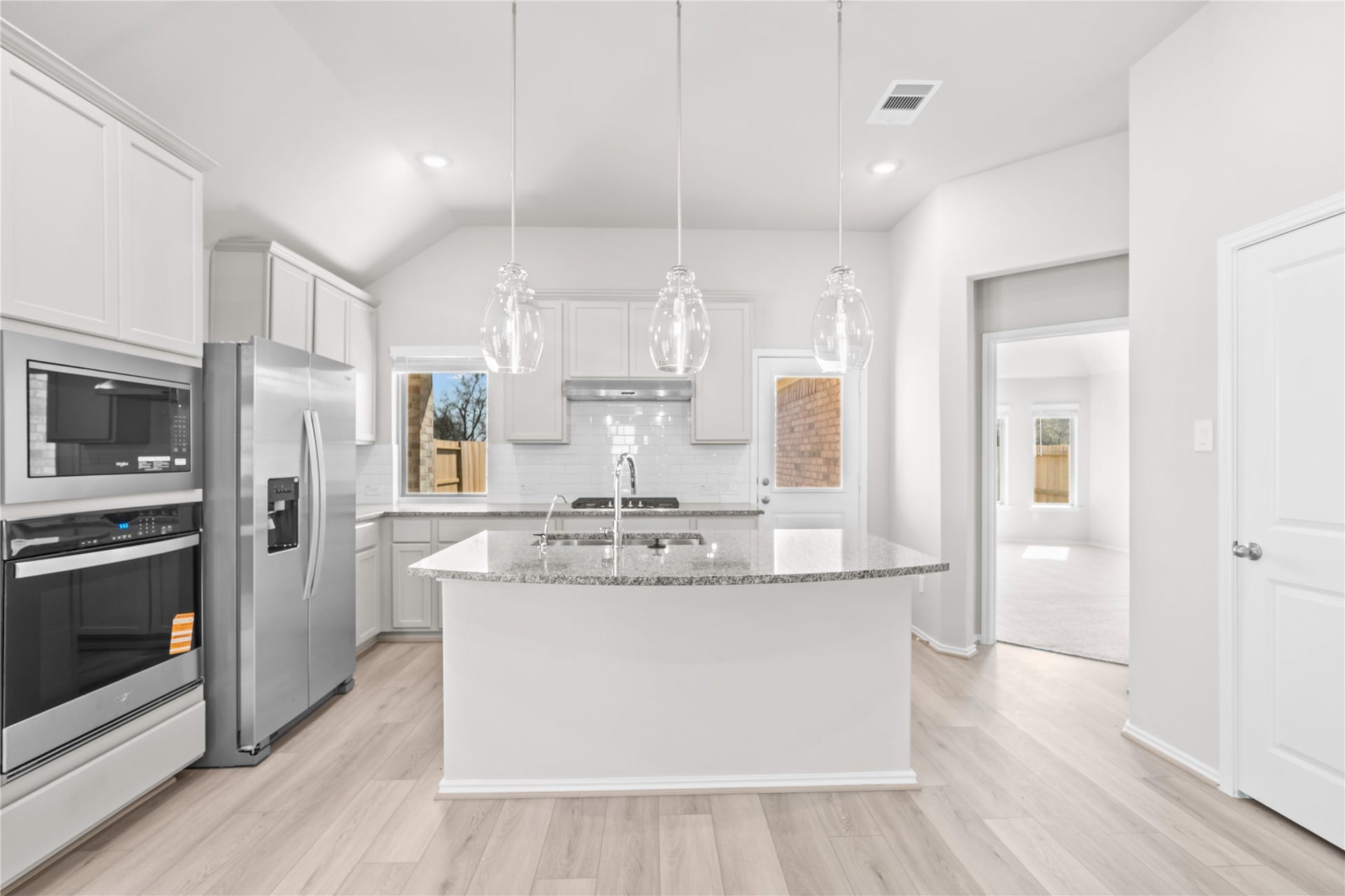 Designed for connection, the kitchen opens to the main living area, with the island creating a natural gathering place.