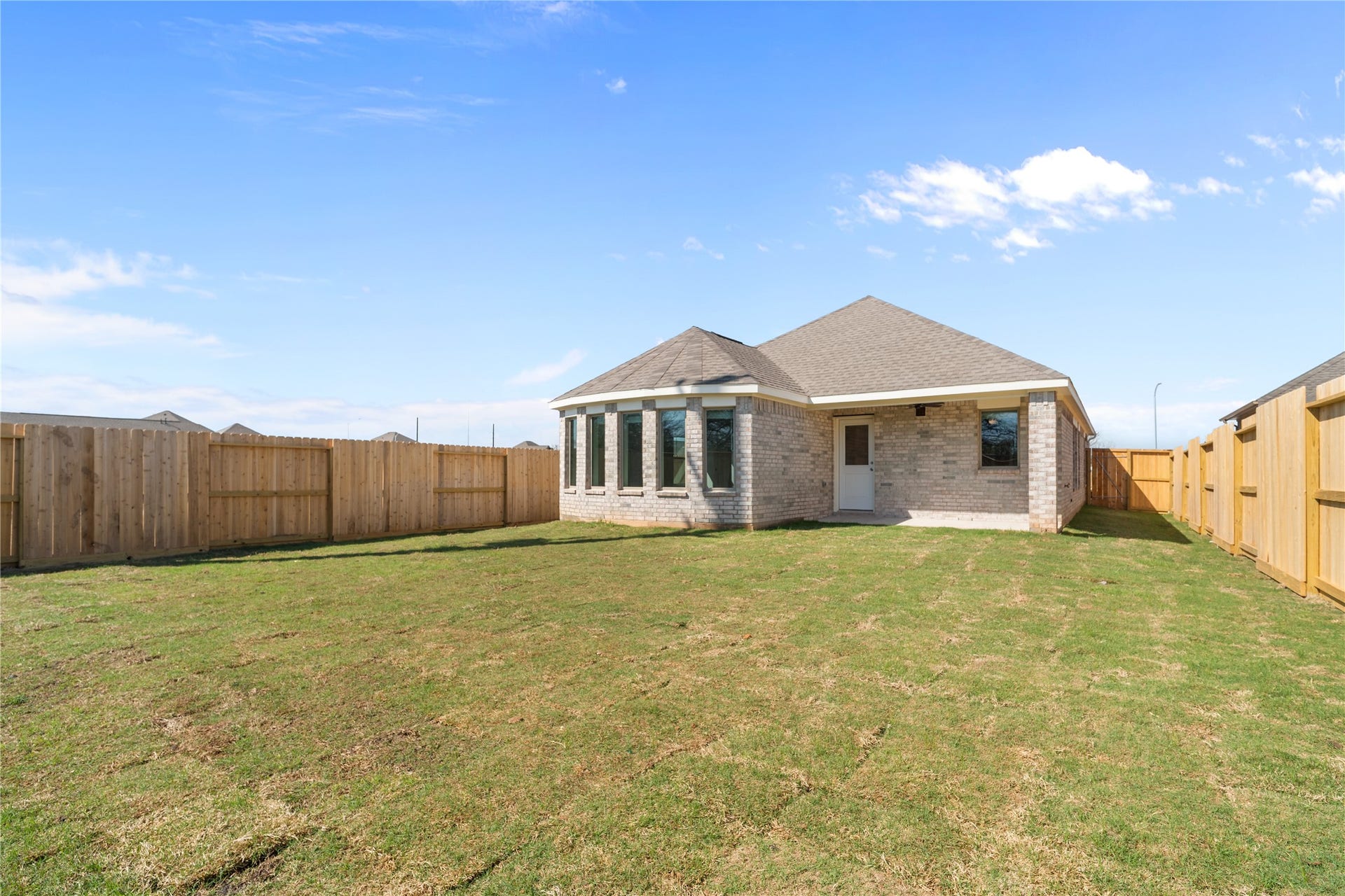 A fully fenced backyard offers plenty of room to relax and entertain.