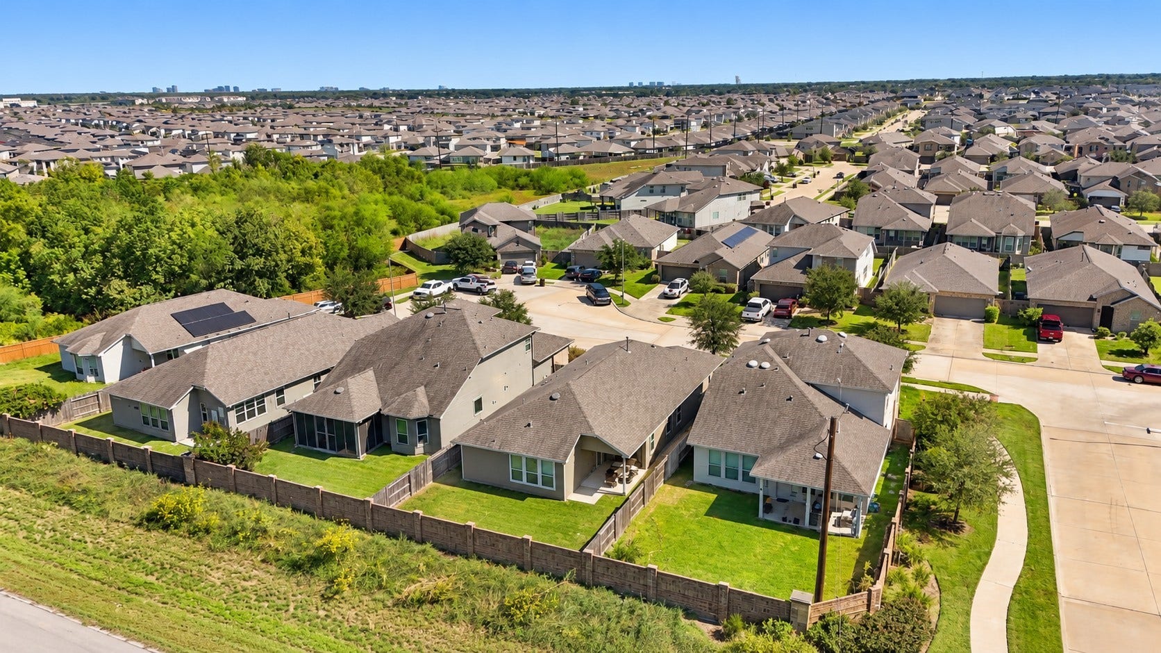 7814 Tindarey Maple Trace, Richmond, TX 77407 Elevated neighborhood view showcases the surrounding residential community and nearby green spaces.