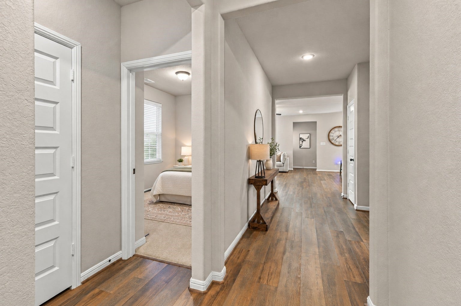 7814 Tindarey Maple Trace, Richmond, TX 77407 Defined entry foyer with wood-look flooring, neutral finishes, and a hallway leading into the main living areas.