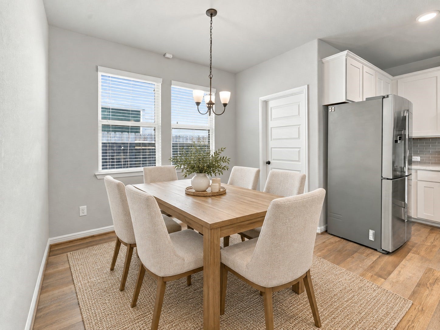 7814 Tindarey Maple Trace, Richmond, TX 77407 Bright dining area with windows overlooking the side yard, and convenient access to the laundry room.**Virtually staged