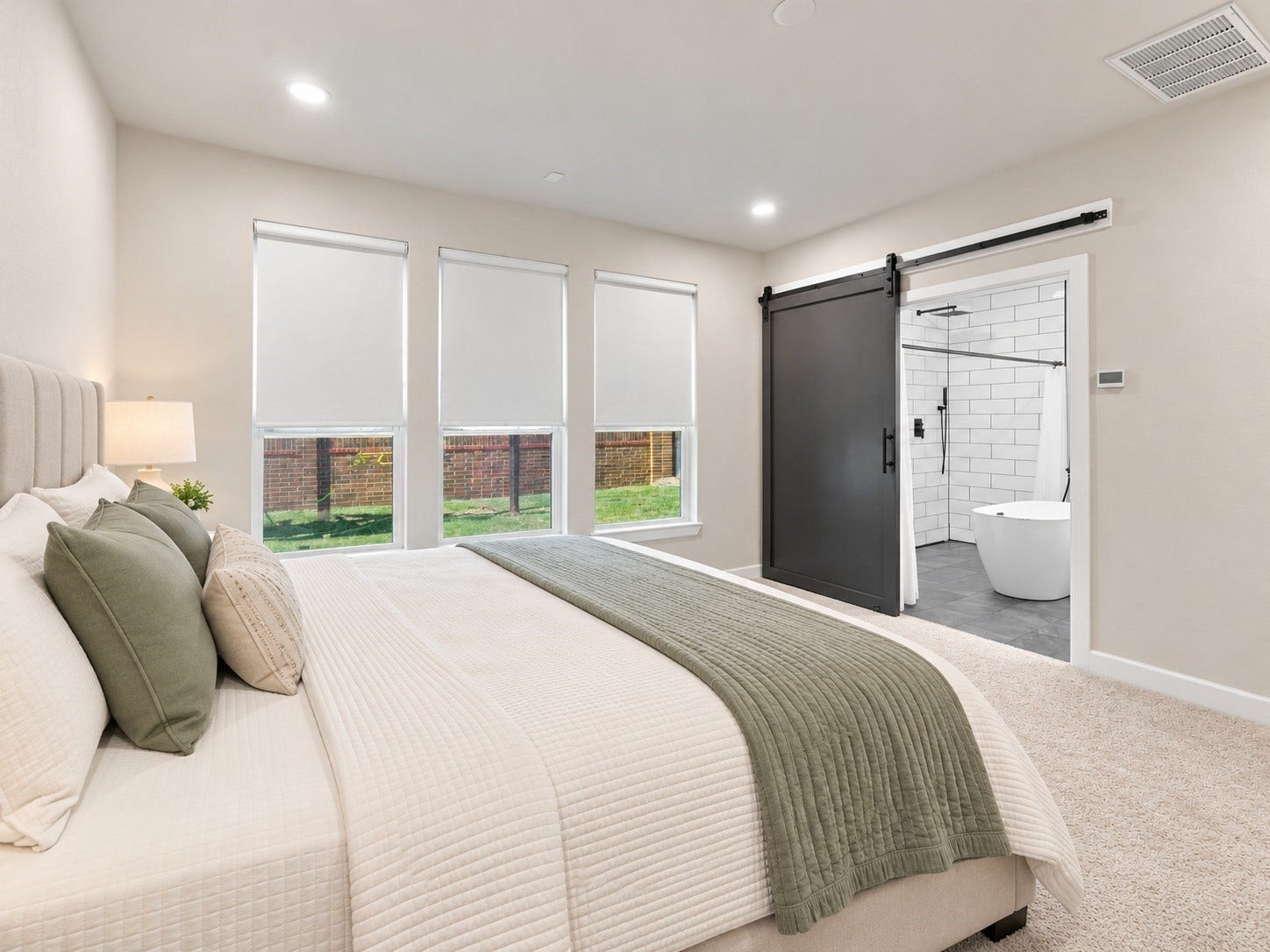 7814 Tindarey Maple Trace, Richmond, TX 77407 Private primary suite with direct access to the ensuite bathroom through a sliding barn door.**Virtually staged