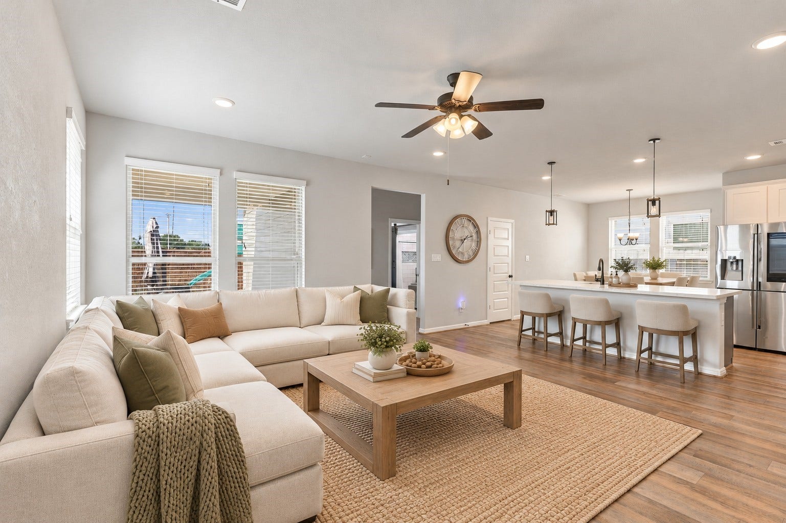 7814 Tindarey Maple Trace, Richmond, TX 77407 Seamless connection between the living room, kitchen, and breakfast bar enhances everyday functionality.**Virtually staged