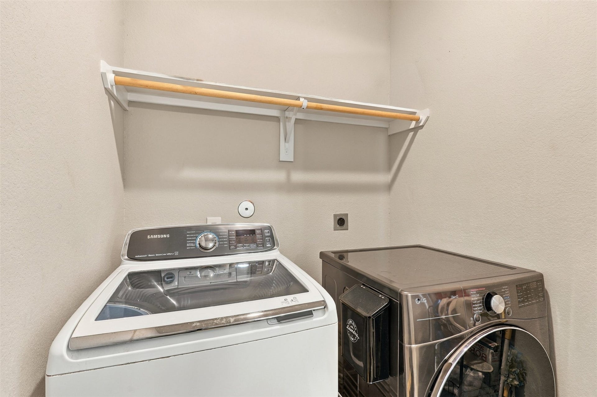 7814 Tindarey Maple Trace, Richmond, TX 77407 Separate laundry room with washer and dryer hookups and overhead storage shelving.