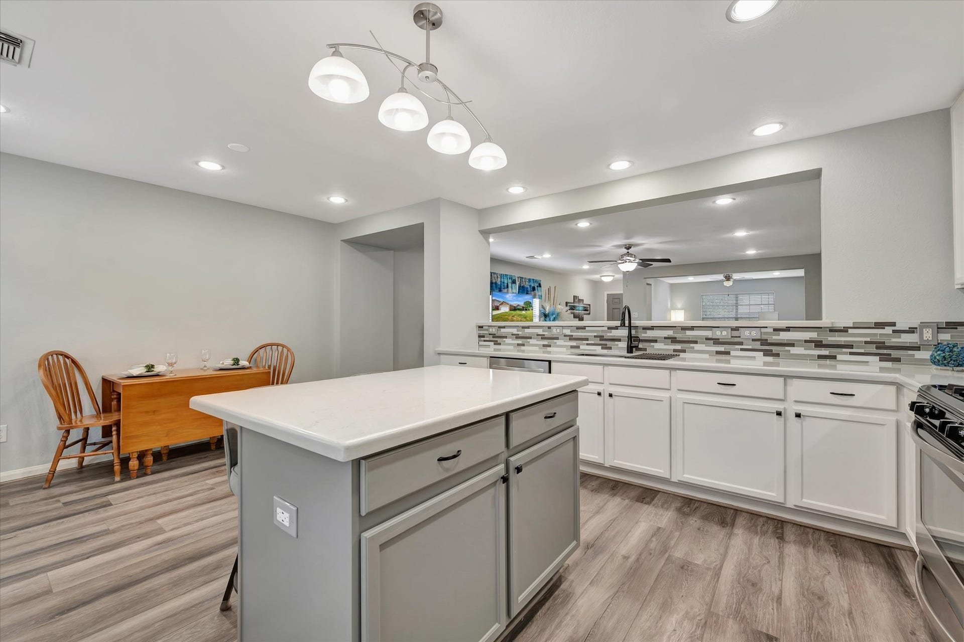 4802 Quiet Canyon Drive, Friendswood, TX 77546 A center island adds storage, extra workspace, and a handy breakfast bar.