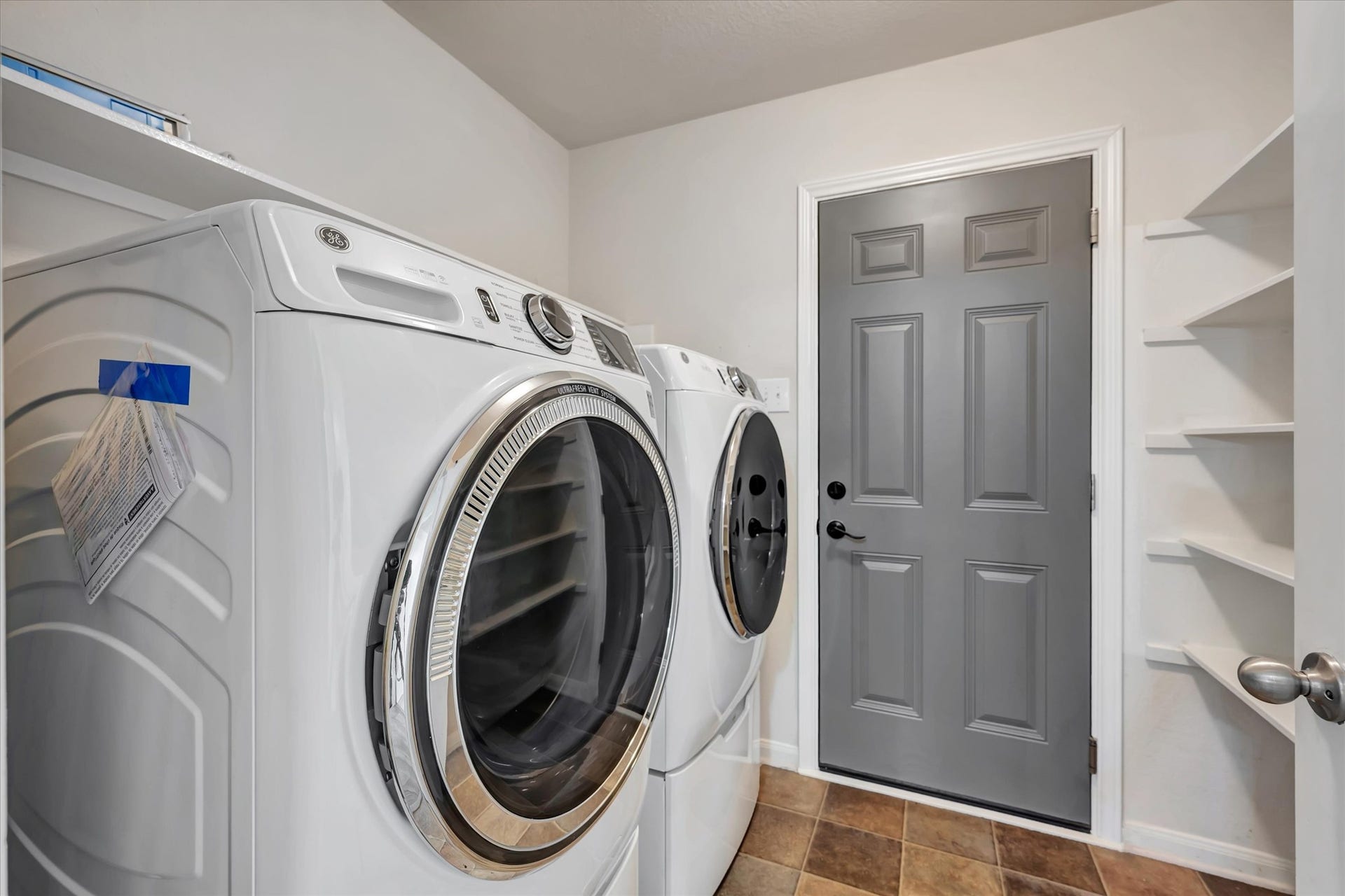 4802 Quiet Canyon Drive, Friendswood, TX 77546 Utility room in house, just off the attached garage.