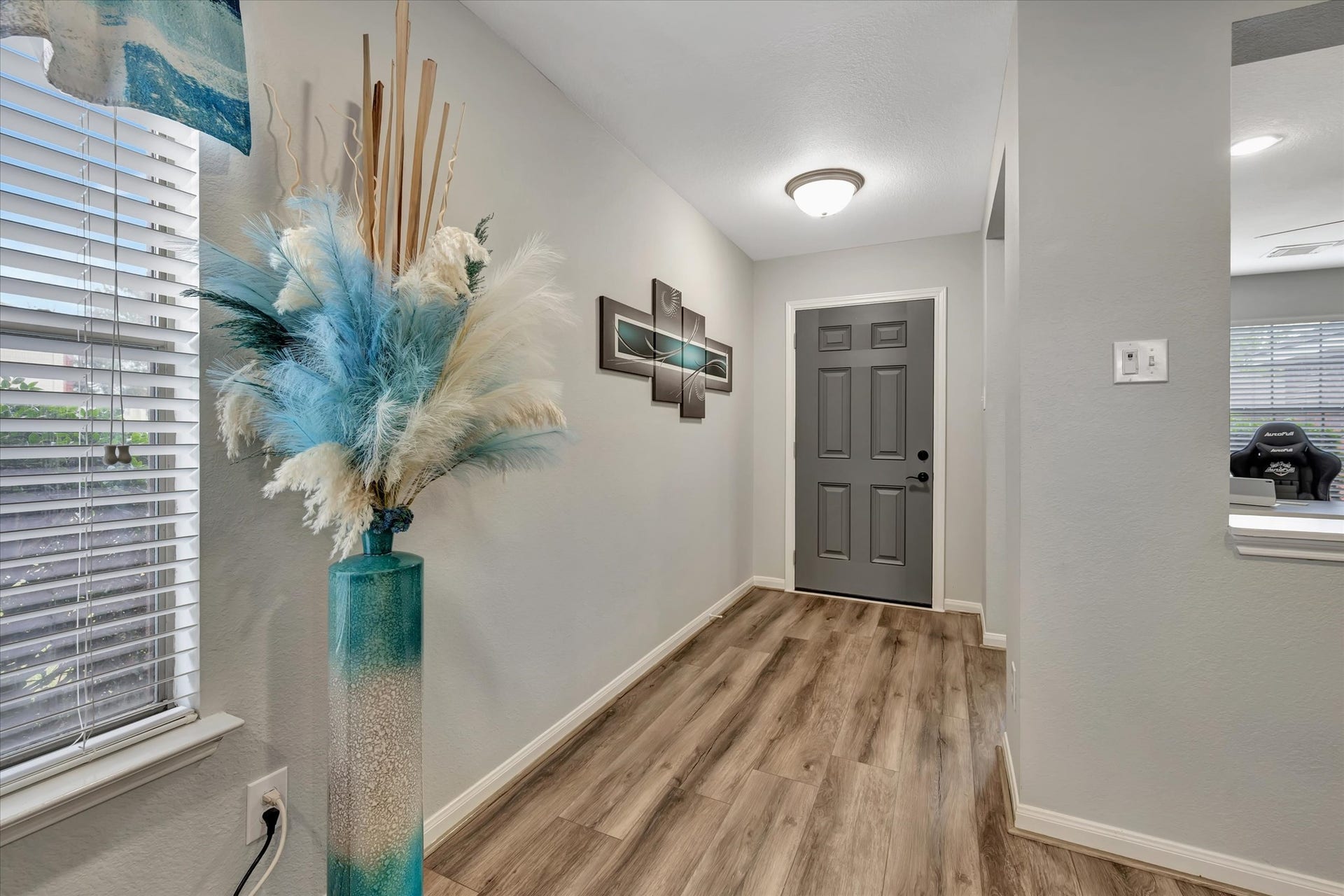 4802 Quiet Canyon Drive, Friendswood, TX 77546 Lovely, durable, and pet-friendly vinyl plank floors flow throughout the living areas.