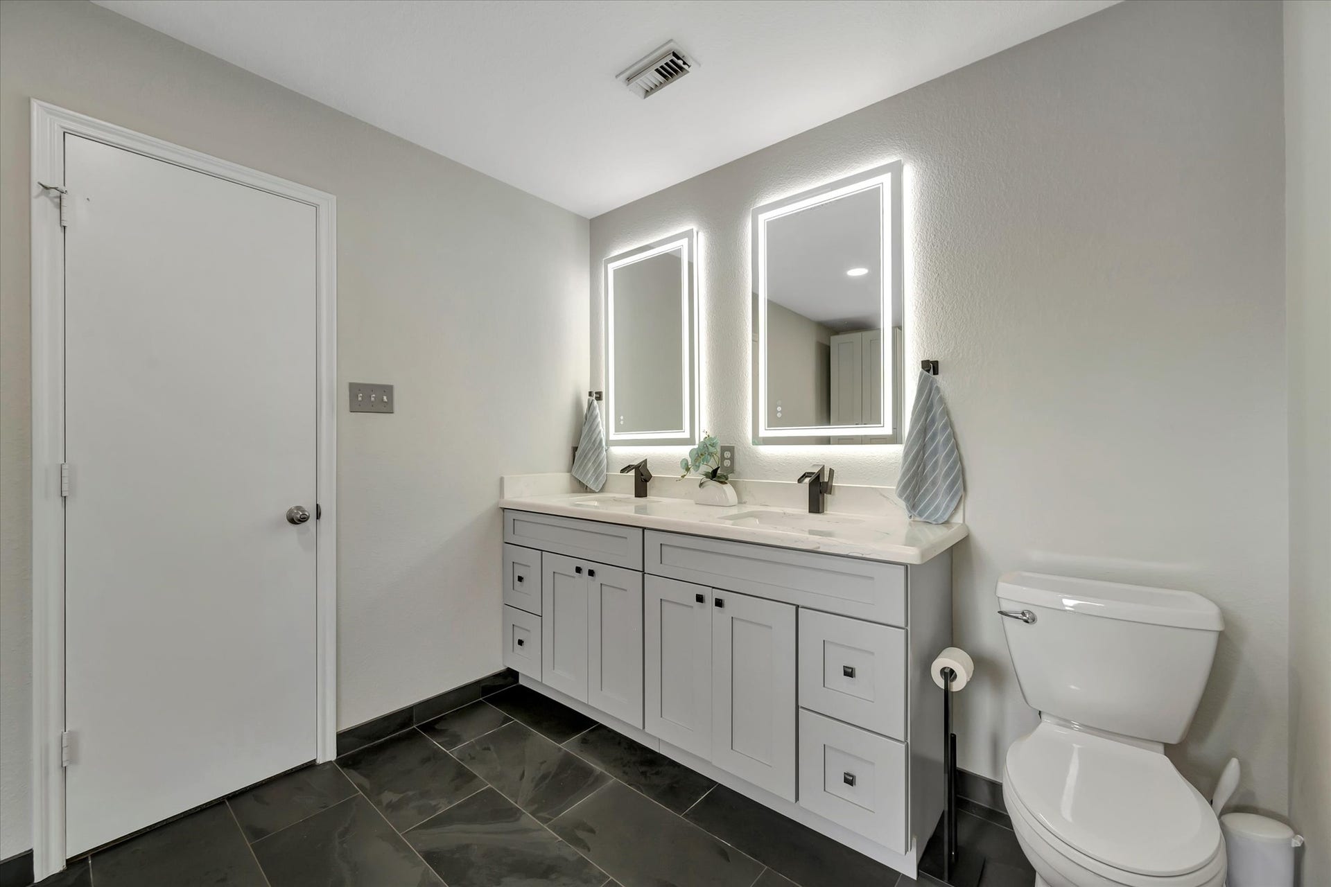 4802 Quiet Canyon Drive, Friendswood, TX 77546 Quartz countertops, recent cabinetry, and slate tile floors.