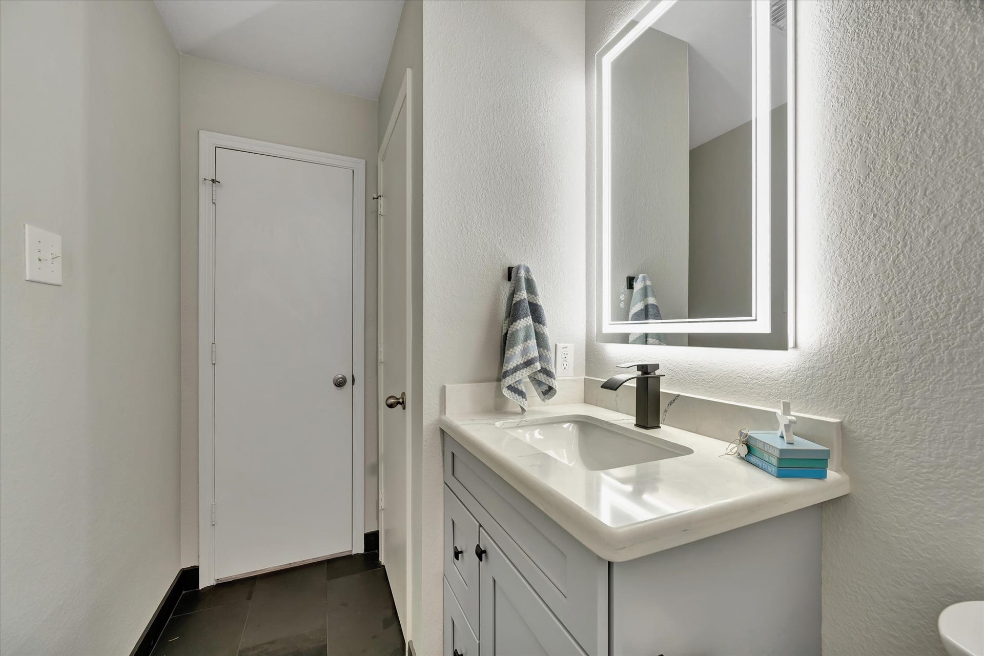 4802 Quiet Canyon Drive, Friendswood, TX 77546 An expansive, lighted linen closet is on the right.