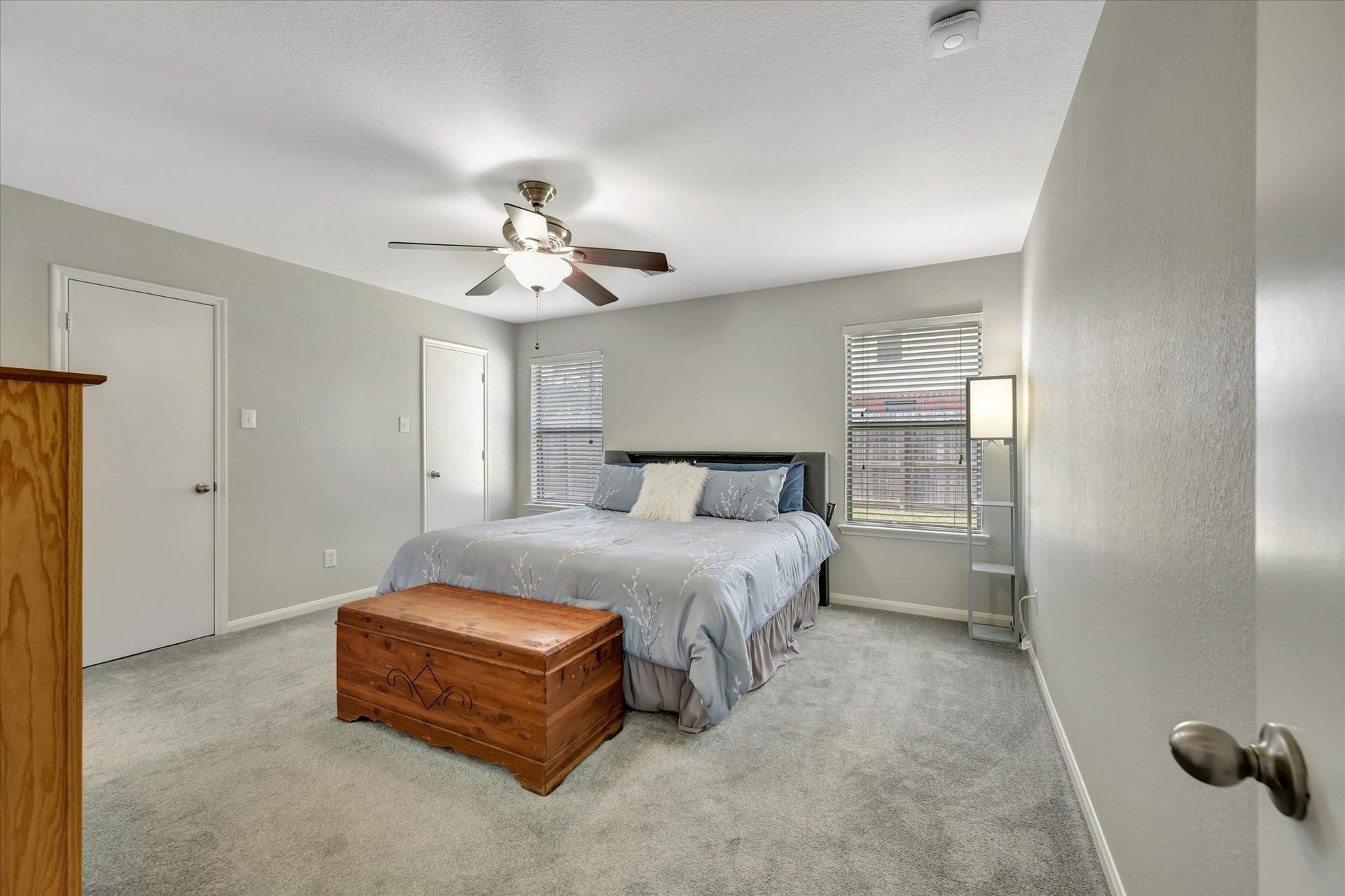 4802 Quiet Canyon Drive, Friendswood, TX 77546 The primary suite is quietly tucked away in the rear of the house. Doors lead to a large walk-in closet.