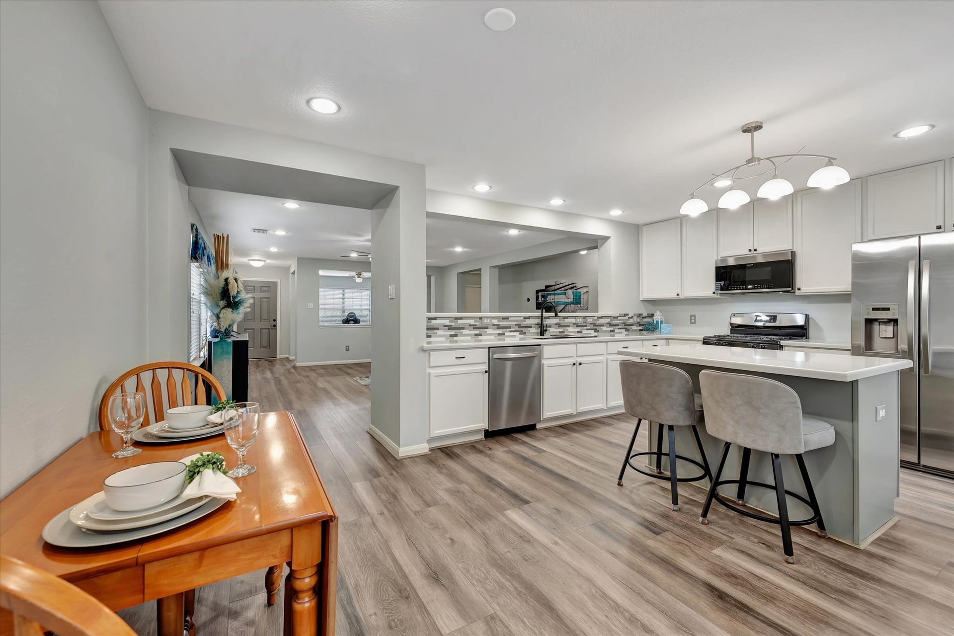 4802 Quiet Canyon Drive, Friendswood, TX 77546 From the kitchen sink, you can keep an eye on little ones playing or be fully engaged with the living room conversation.