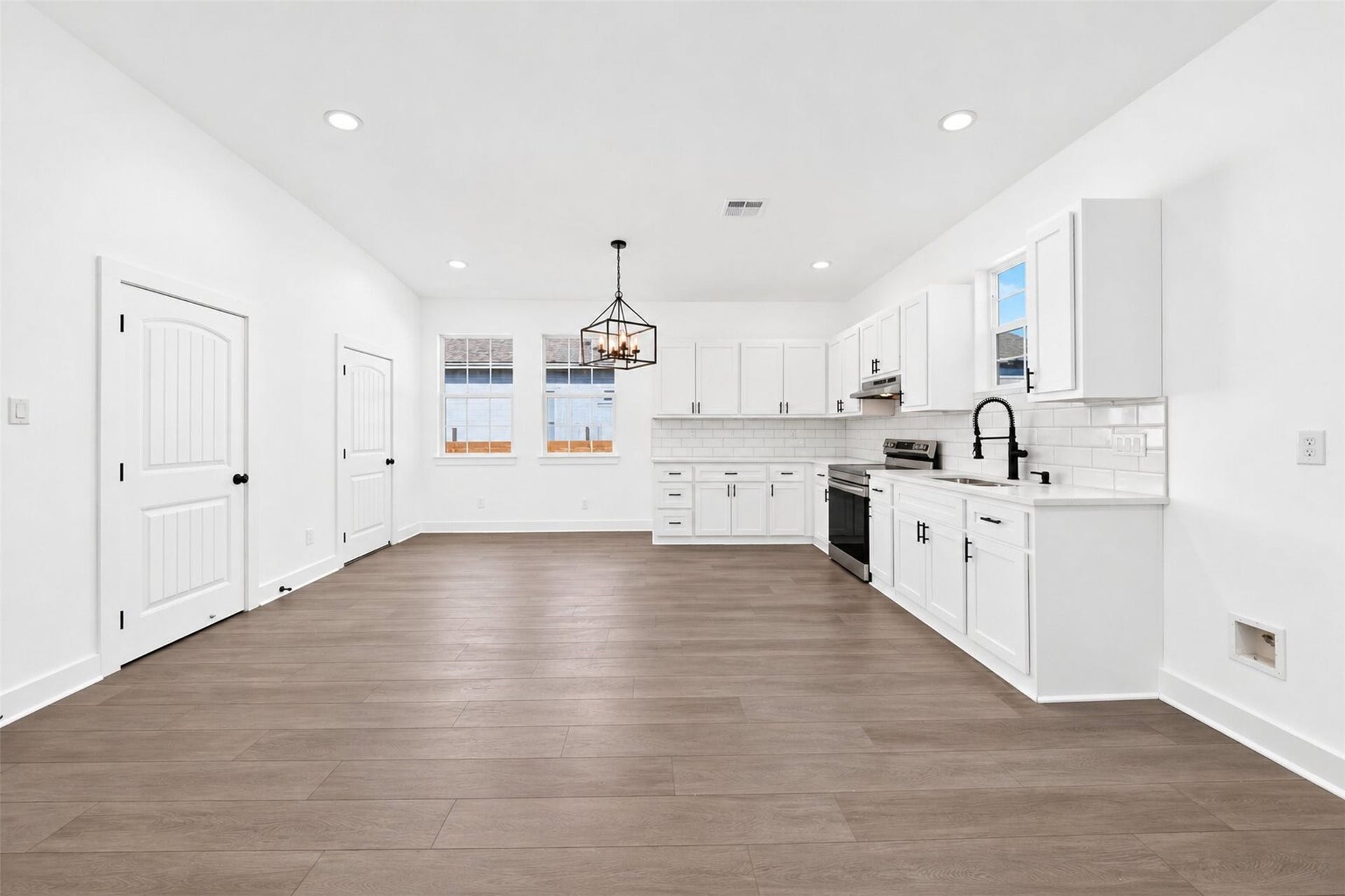A kitchen equipped with contemporary and new appliances.