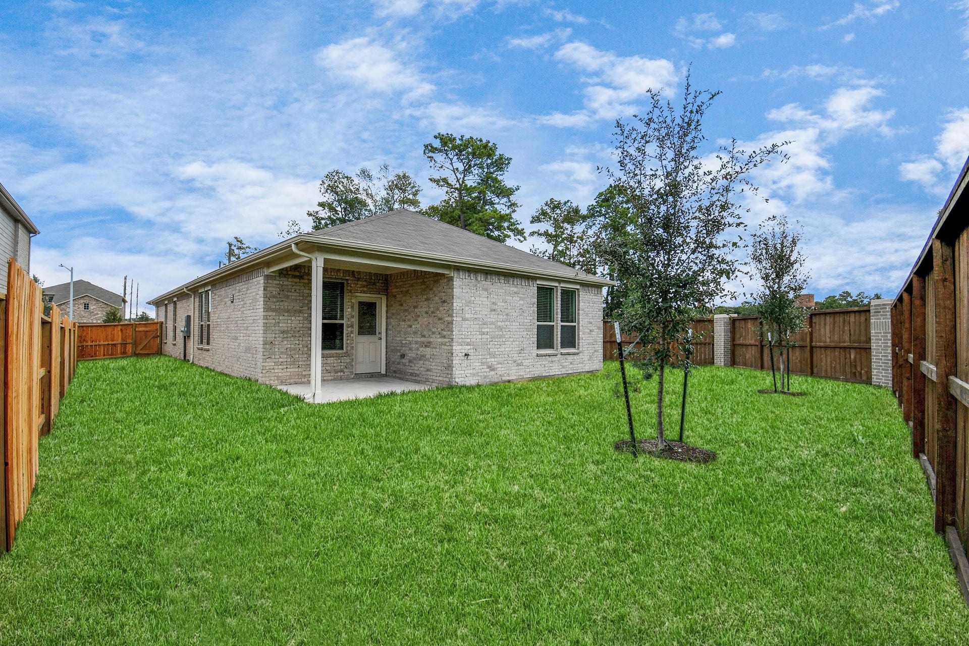 16150 Elbridge Court, Conroe, TX 77302 Spacious backyard with cover patio.