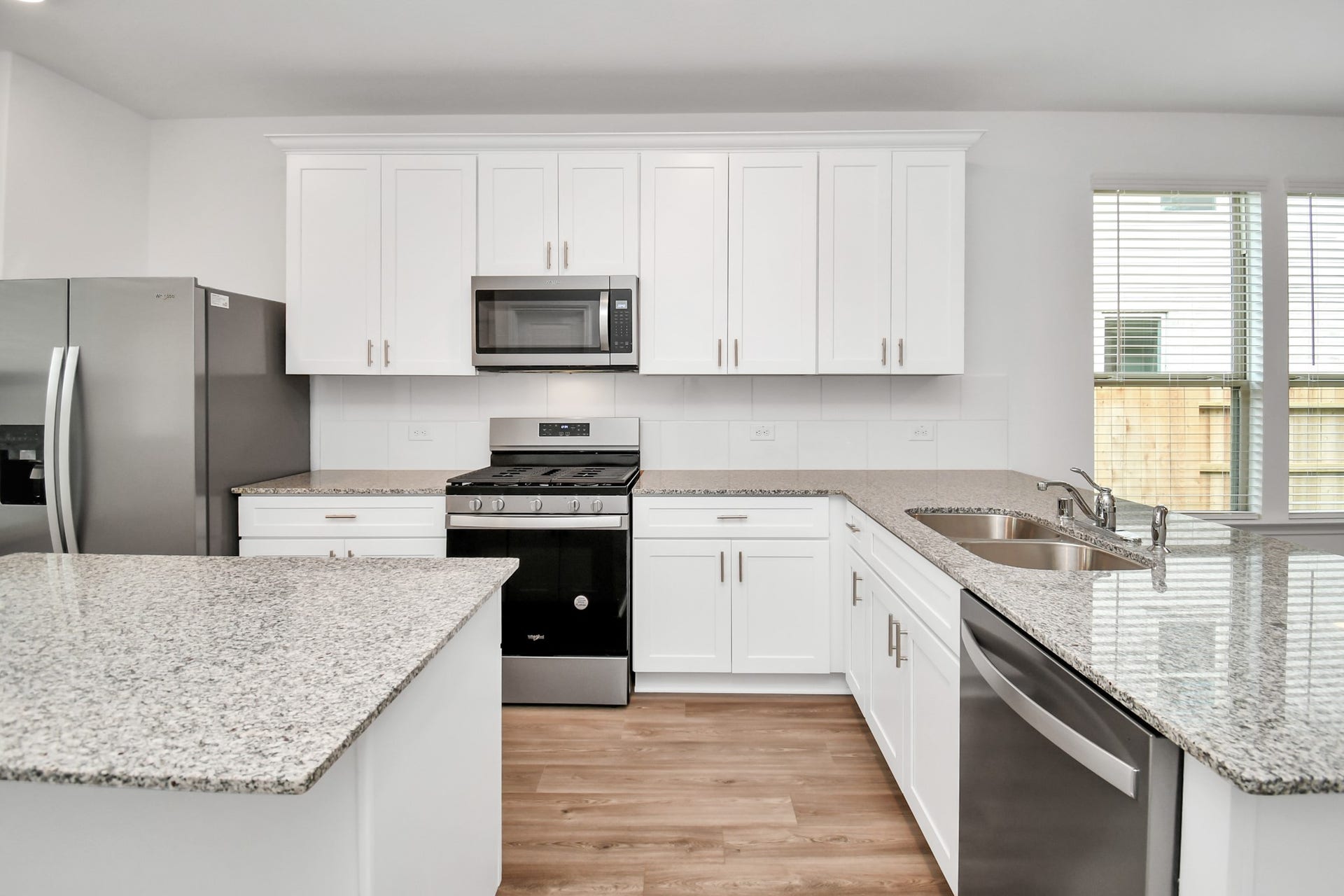 16150 Elbridge Court, Conroe, TX 77302 Not only does the kitchen have an island it also features a breakfast bar.