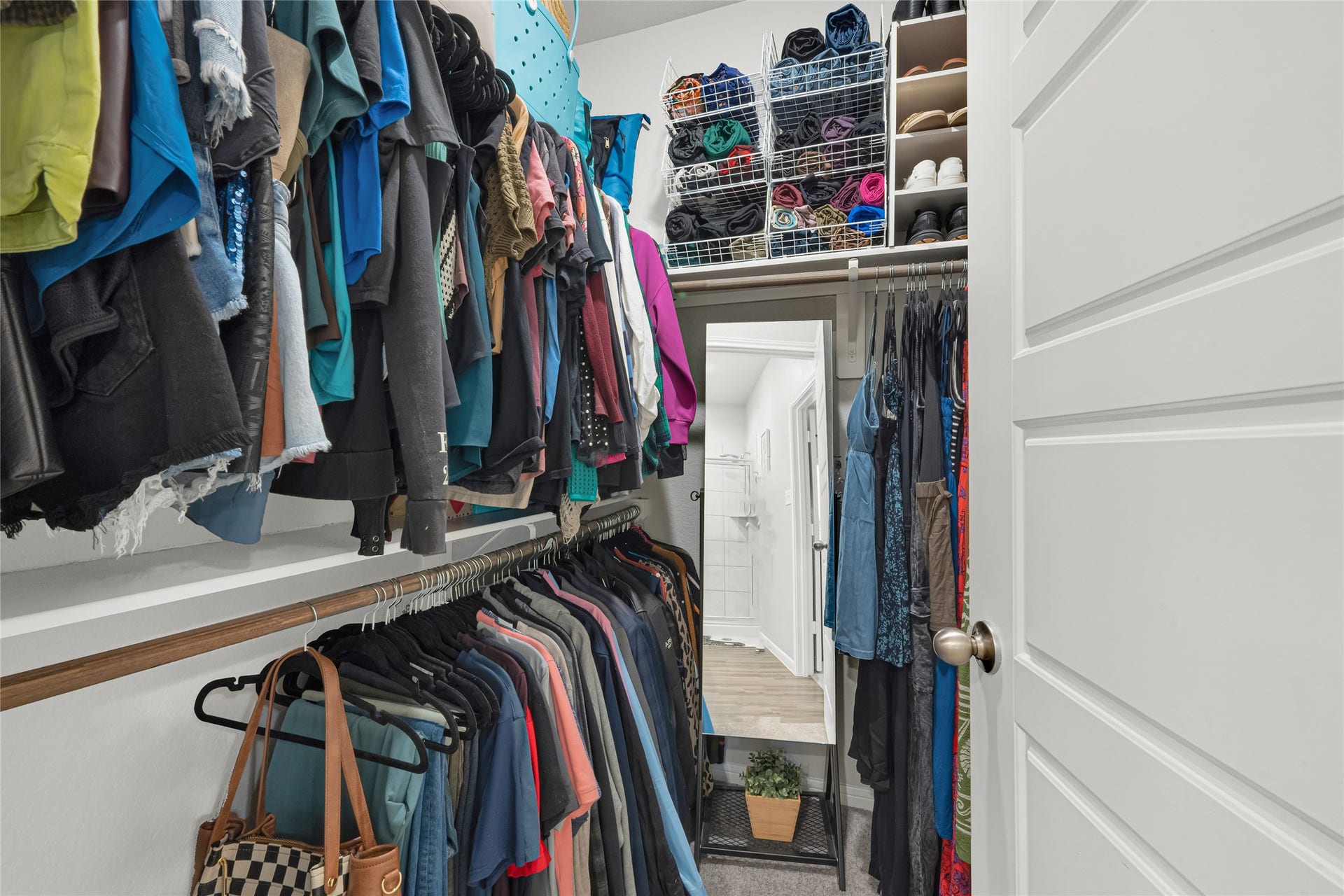 515 Emerald Thicket Lane, Houston, TX 77336 This generous walk-in closet features ample hanging space and built-in shelving plenty of room to stay organized and keep everything in its place.