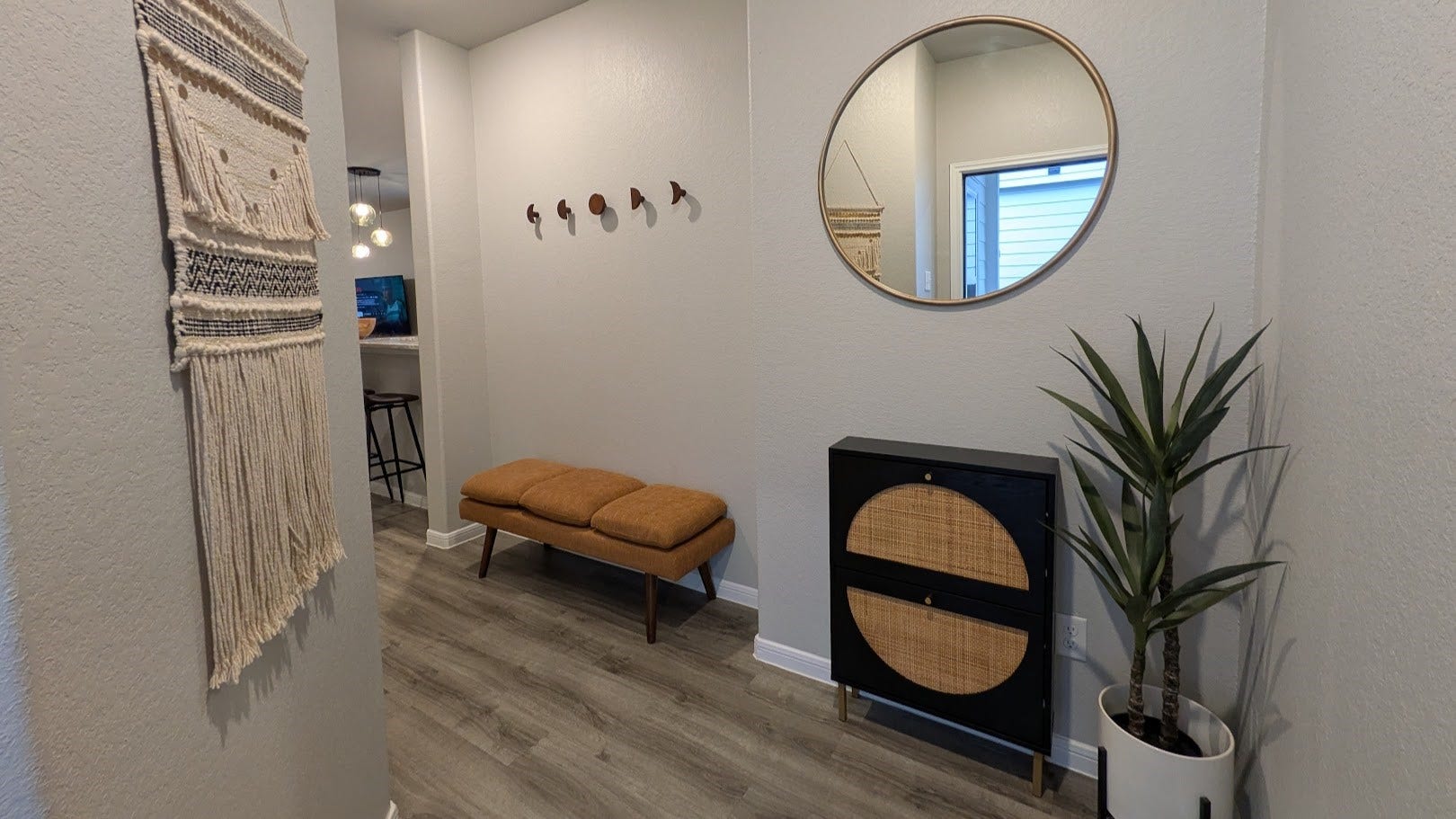 515 Emerald Thicket Lane, Houston, TX 77336 This entryway boasts a sleek, minimalist design with light gray walls and stylish vinyl wood plank flooring. This entry design offers privacy with its recessed door placement, helps to maintain the privacy of your living space.