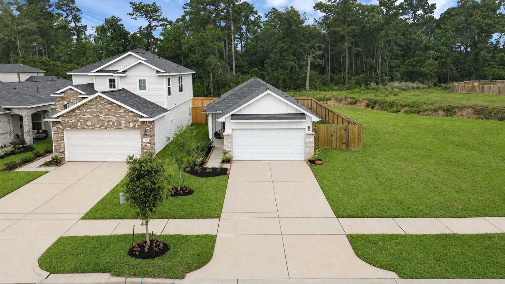 515 Emerald Thicket Lane, Houston, TX 77336 This fabulous single-story home features an extra long double sided driveway offering plenty of parking space. The neighborhood is lined with trees and sidewalks, providing a serene backdrop.