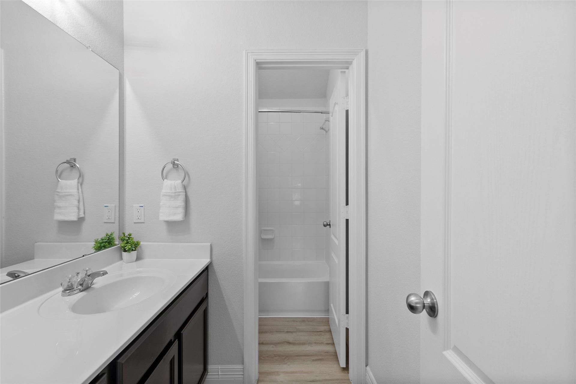 Your bathroom keeps the morning routine easy with a spacious vanity, generous counter space, and a separate area for added privacy.