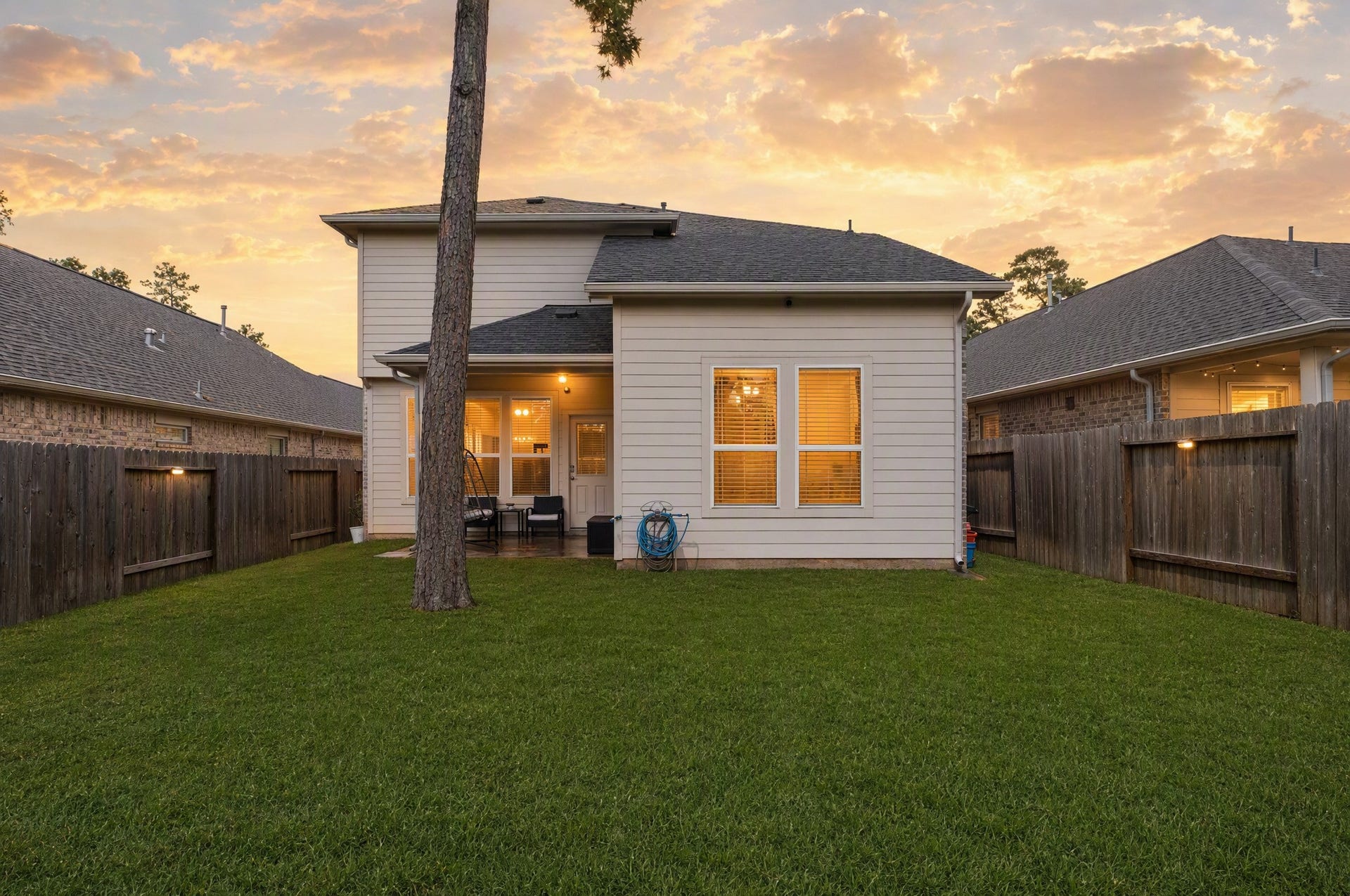 Step out back to your covered patio and open yard, where weekend cookouts and relaxed evenings can become part of your routine. This photo has been digitally edited.
