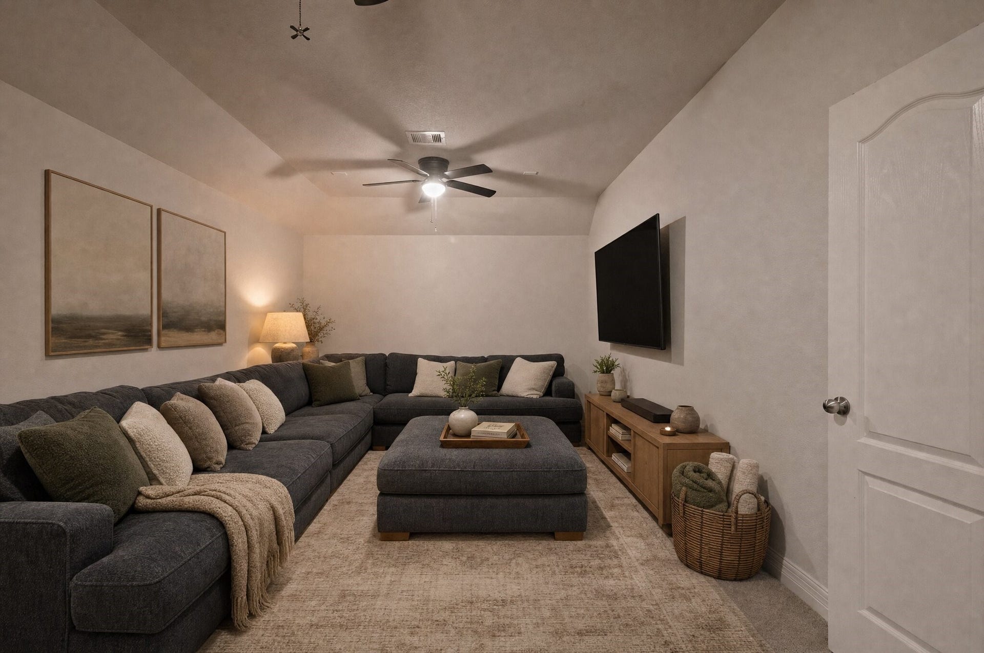 Movie nights feel right at home in this cozy upstairs retreat, with plenty of space to stretch out and settle in. This photo has been digitally edited.