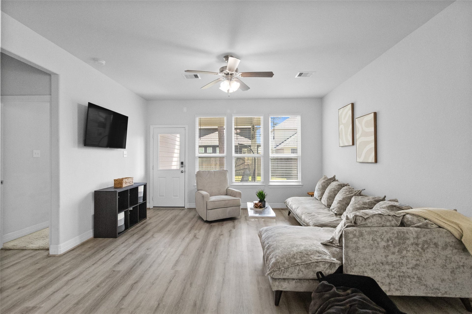 Your living room feels bright and welcoming, with plenty of space to stretch out, relax, and spend time together.