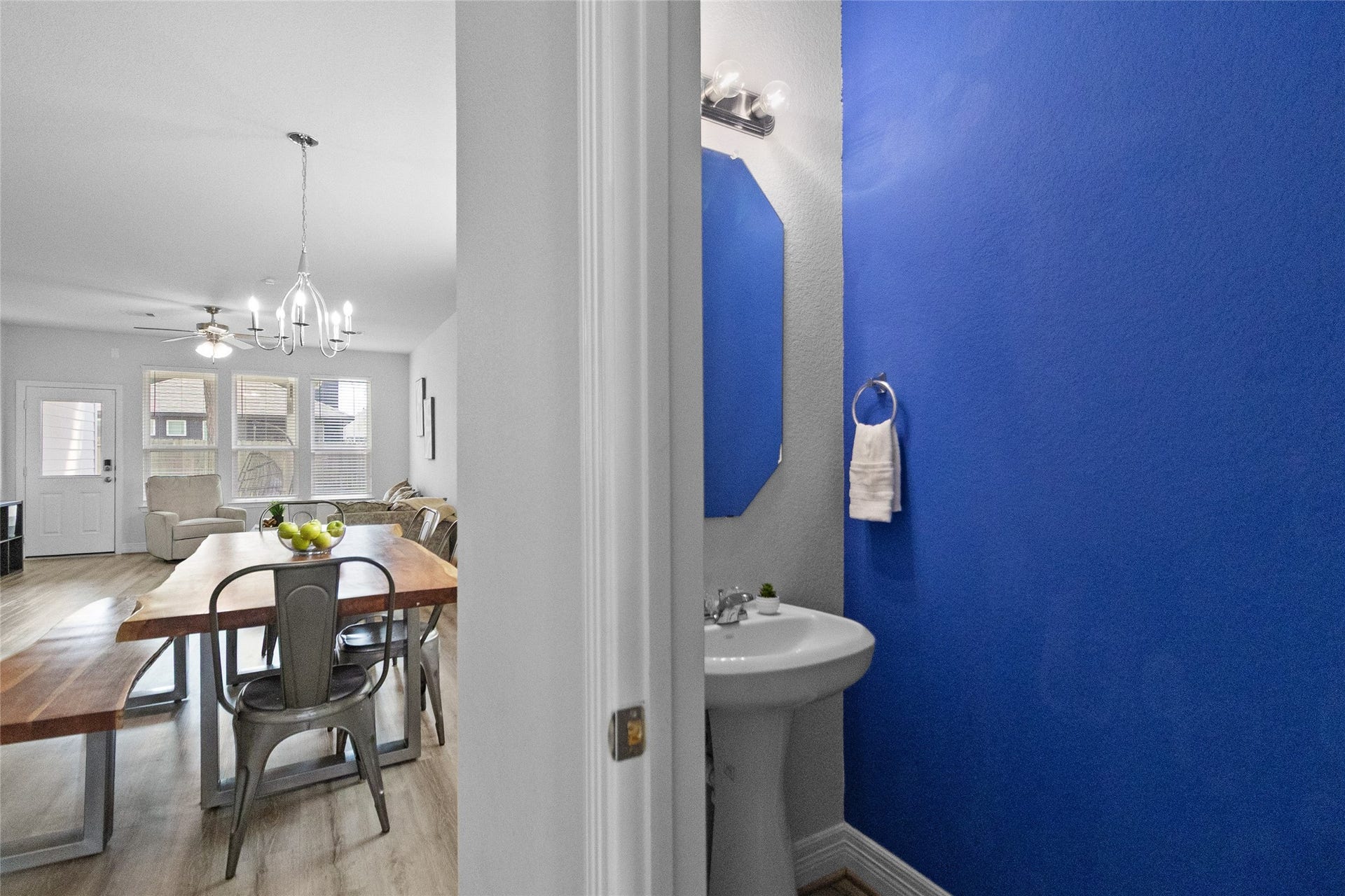 Your convenient powder room sits just off the main living areas, making it easy for guests to freshen up without heading upstairs.